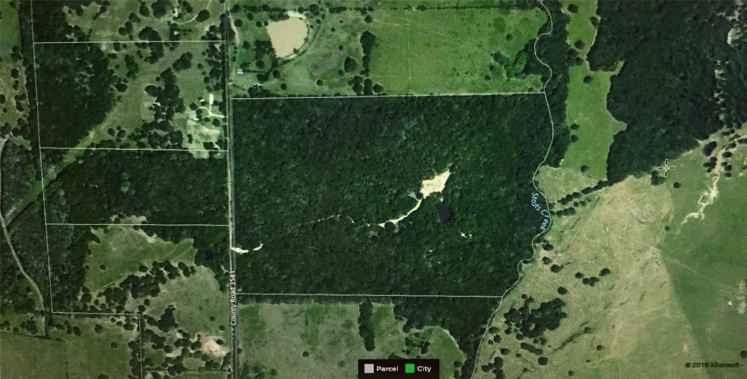 Active creek on eastern border.