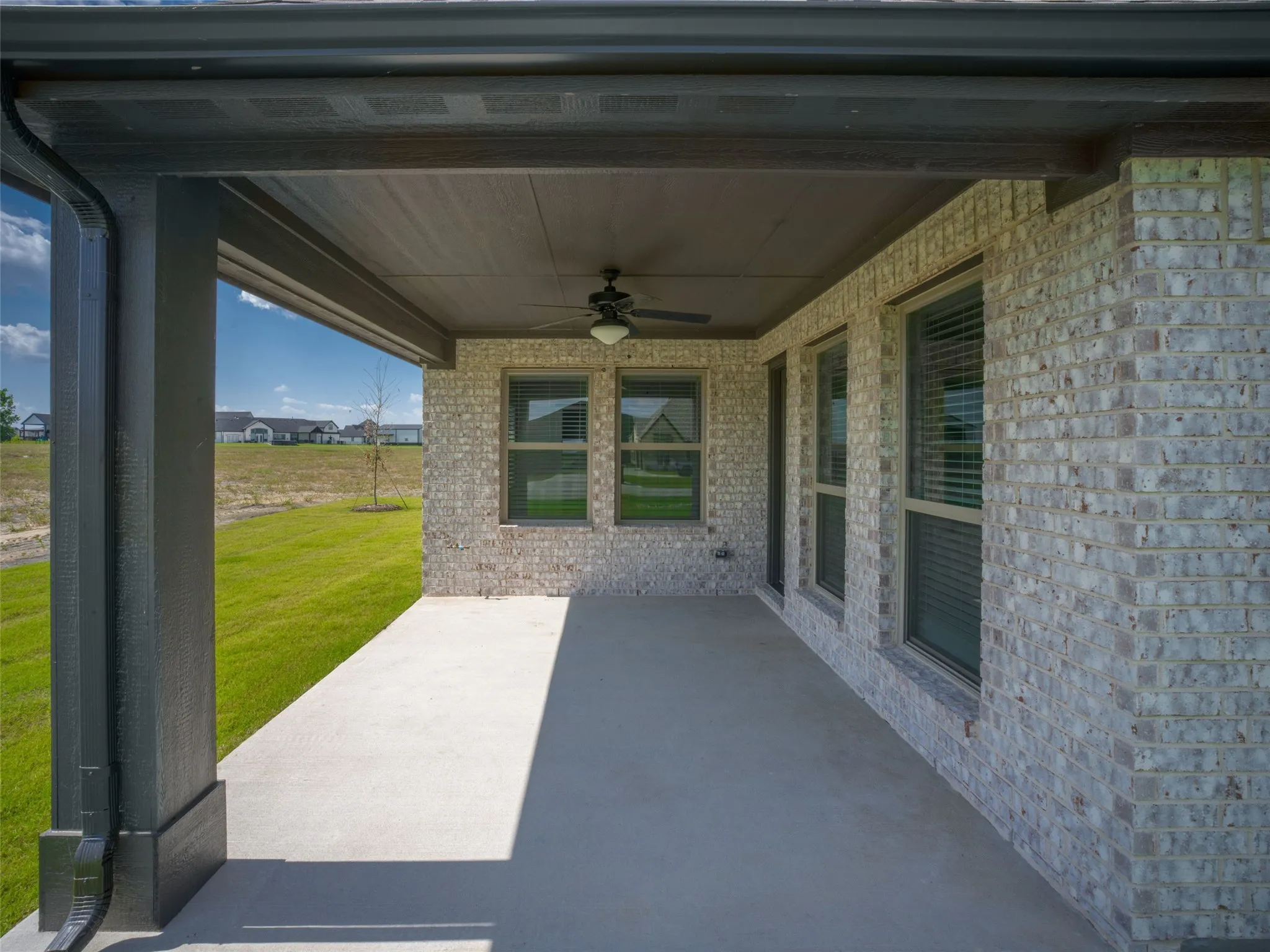 View of patio featuring ceiling fan