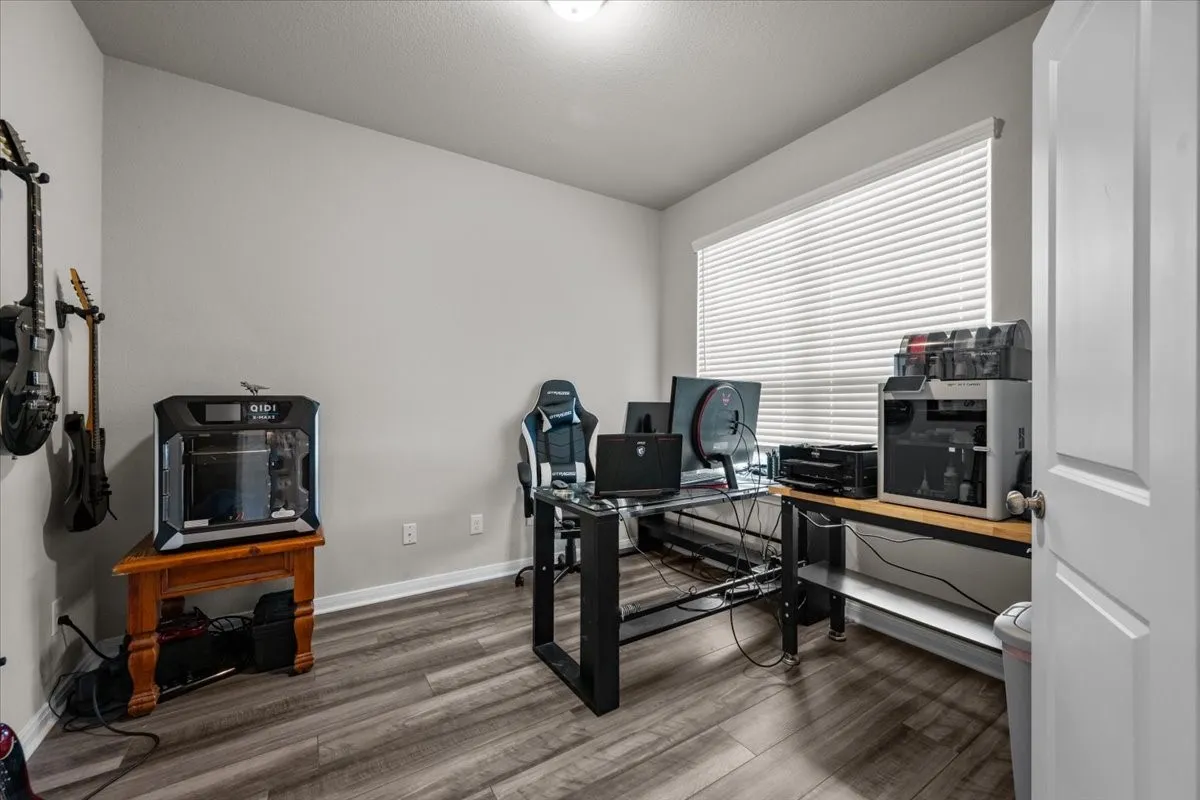 Office area with wood finished floors and baseboards