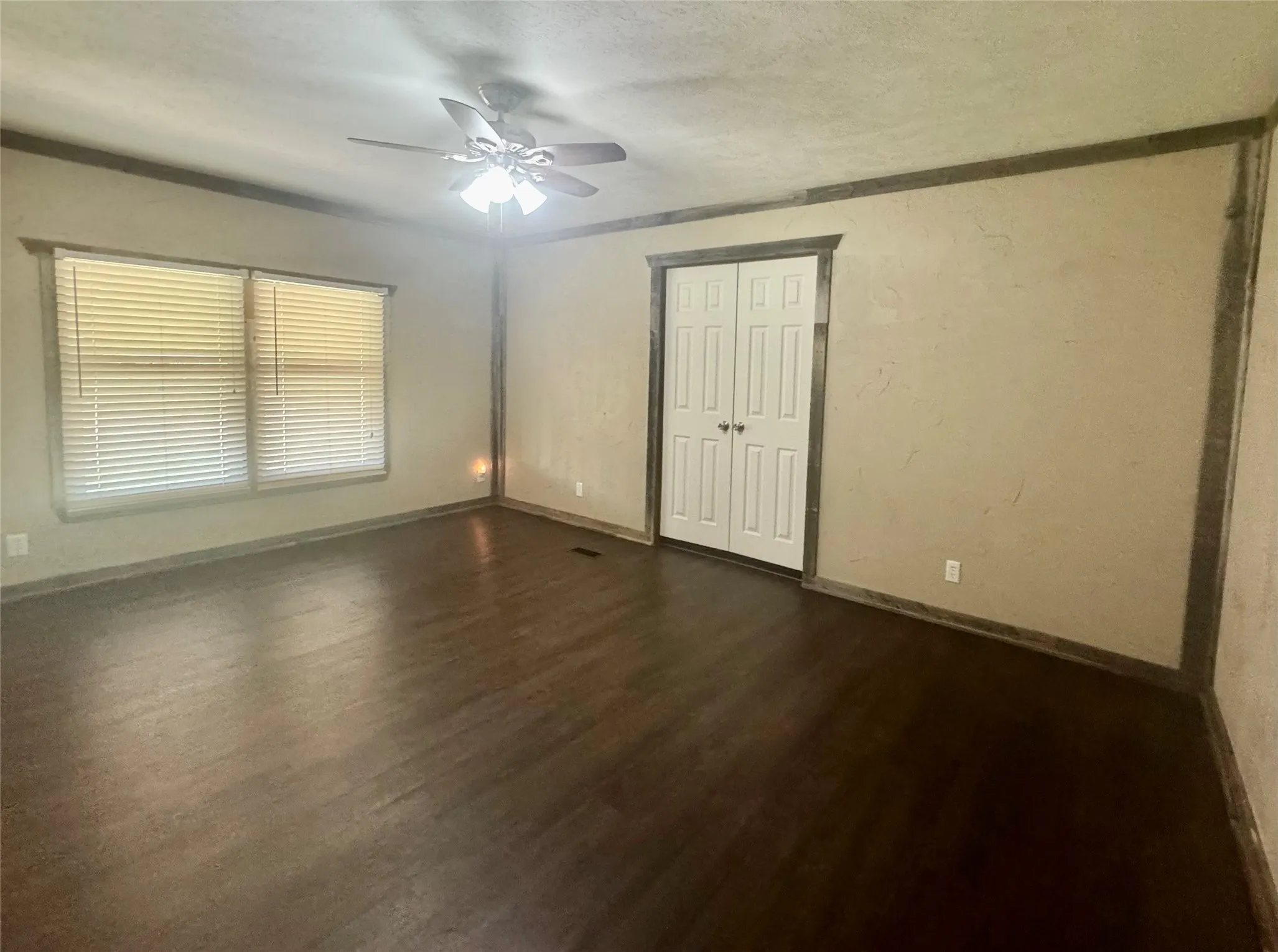 Primary bedroom has room for all your furnishings