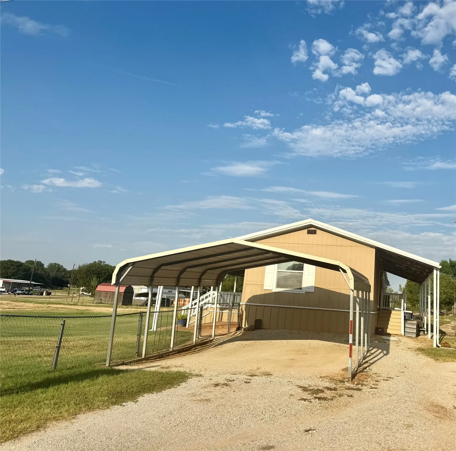 Detached two car carport, private driveway and plenty of parking room