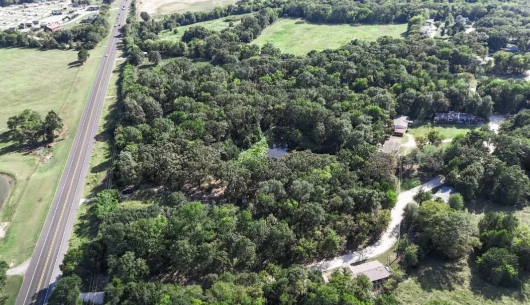 Aerial overview of property's location featuring a major roadway