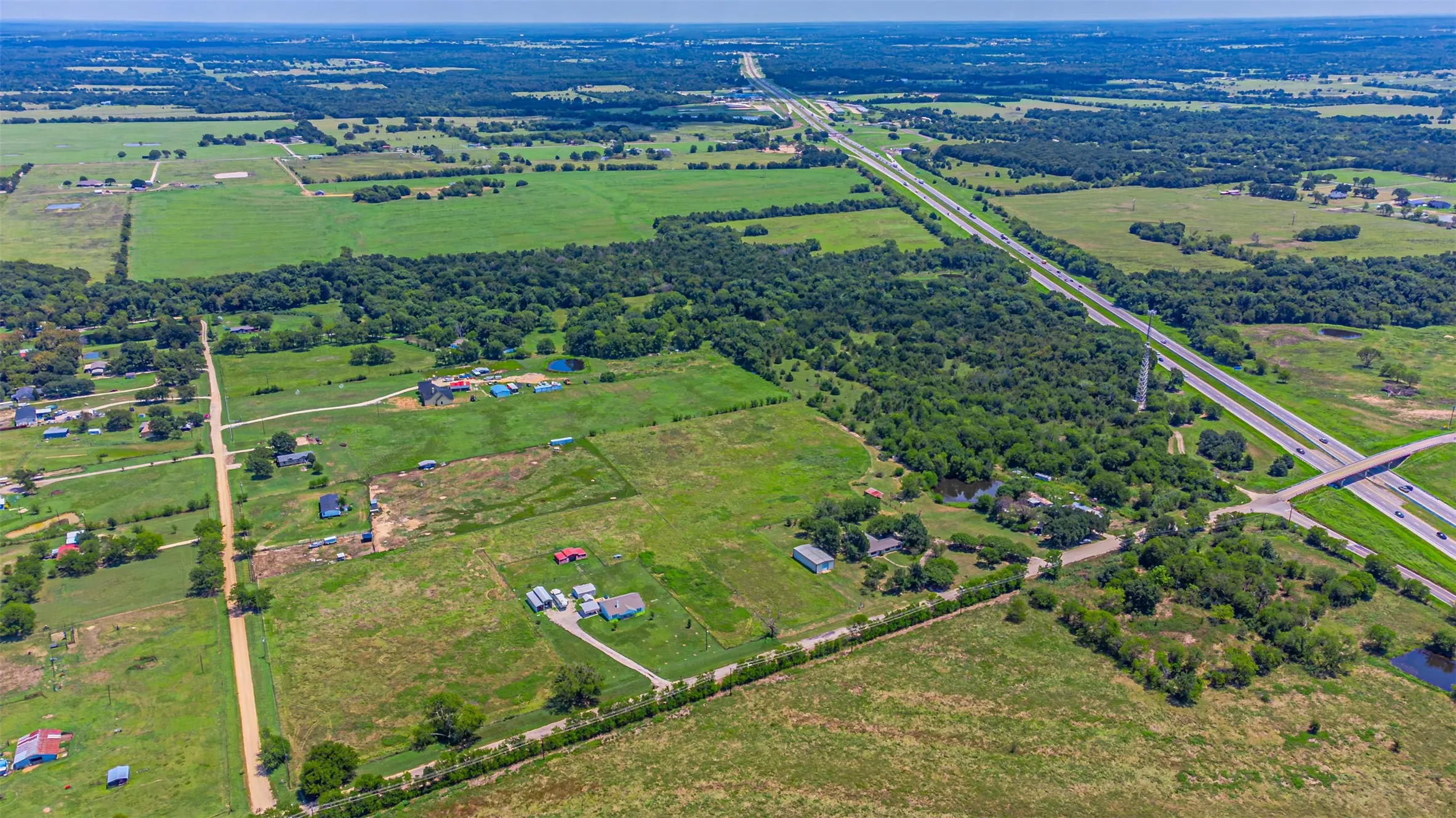 Aerial overview of property's location featuring rural landscape