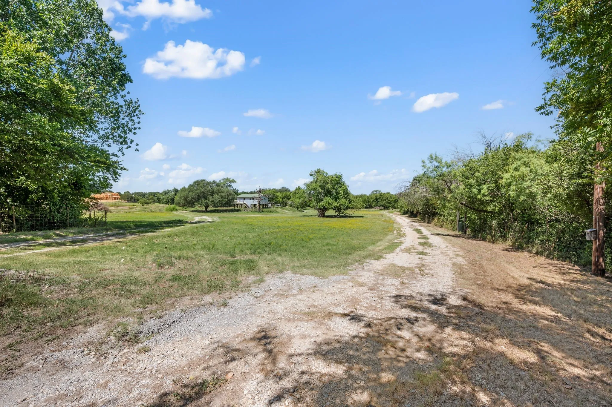 View of dirt / gravel road featuring a rural view