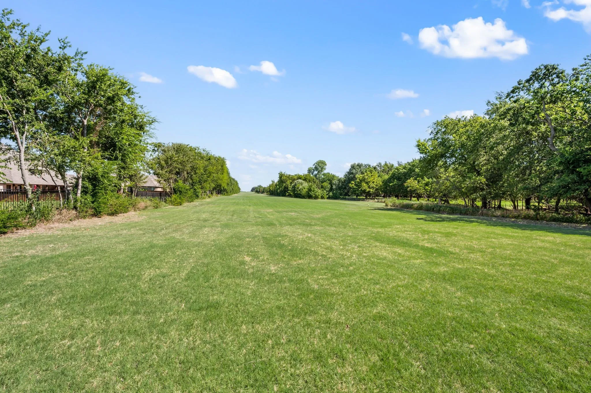 View of yard featuring view of wooded area