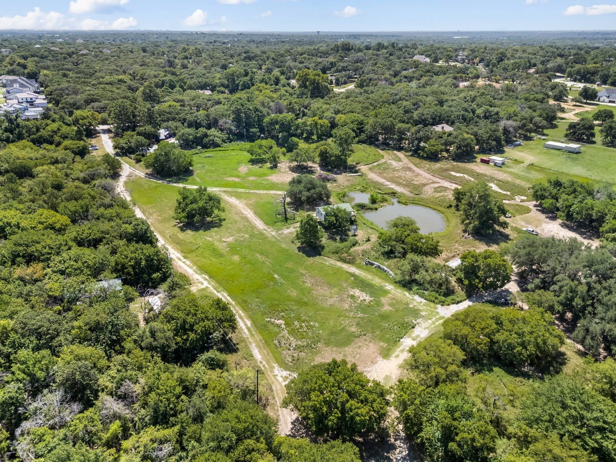 Drone / aerial view of a forest and a large body of water