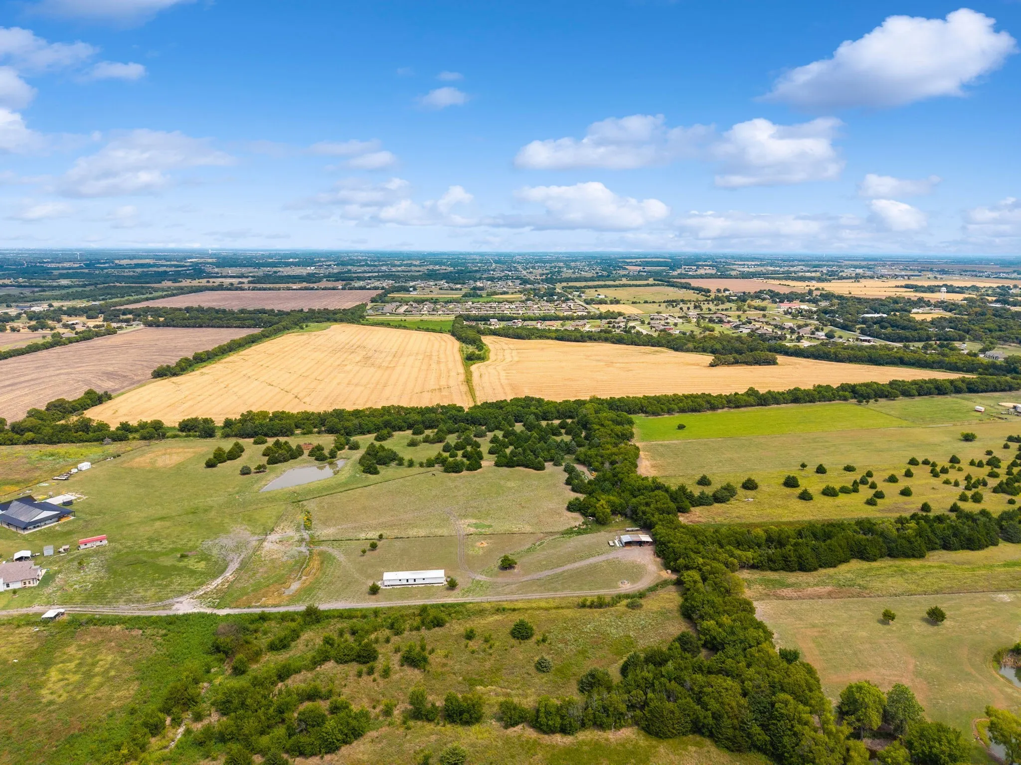 Overview of rural landscape featuring farmland