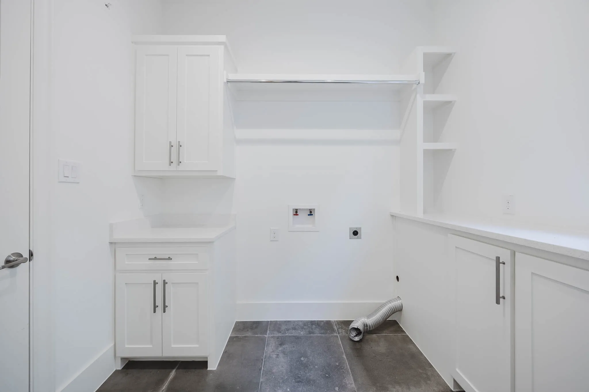 Laundry room featuring hookup for a washing machine, hookup for an electric dryer, and cabinet space