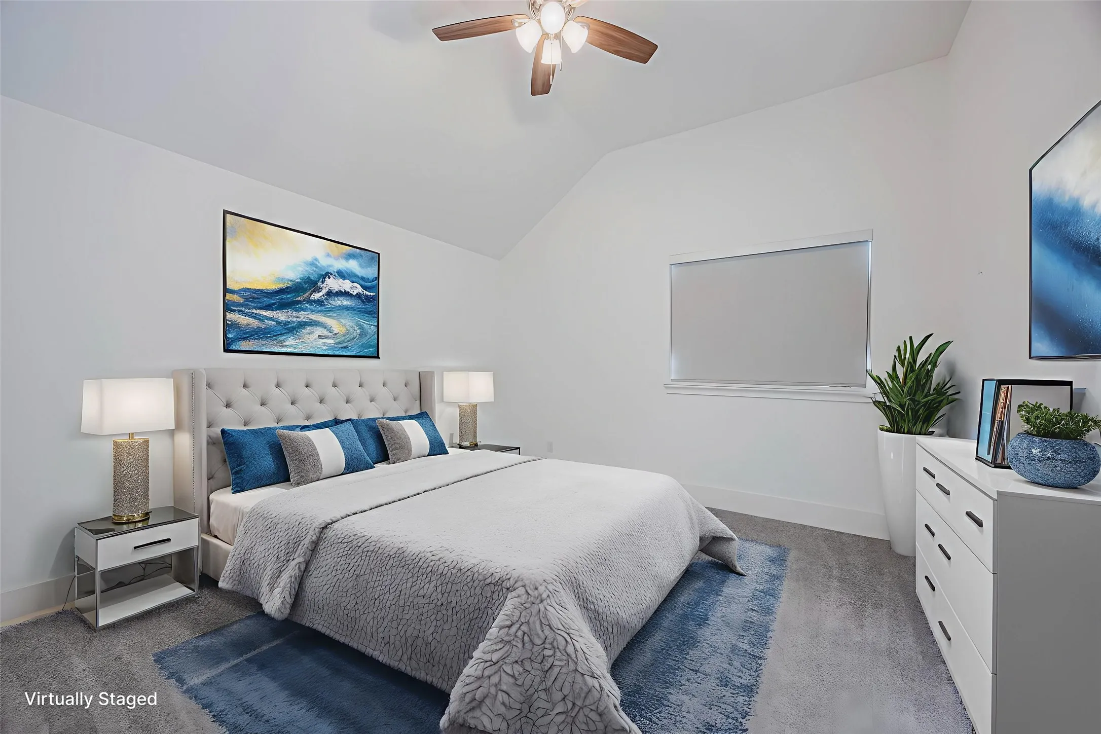 Bedroom featuring light colored carpet, vaulted ceiling, and a ceiling fan