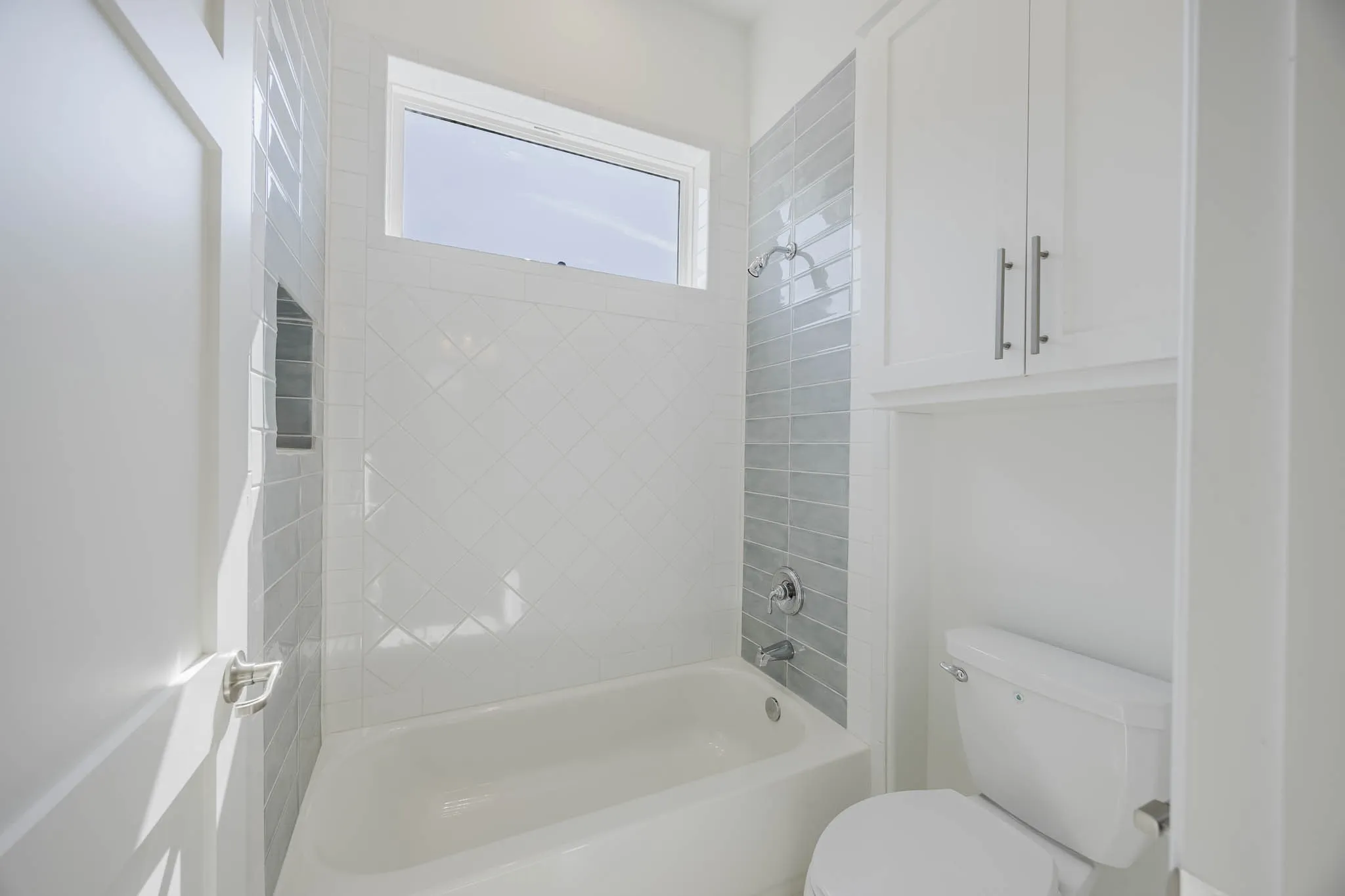 Full bath featuring shower / bathtub combination and toilet
