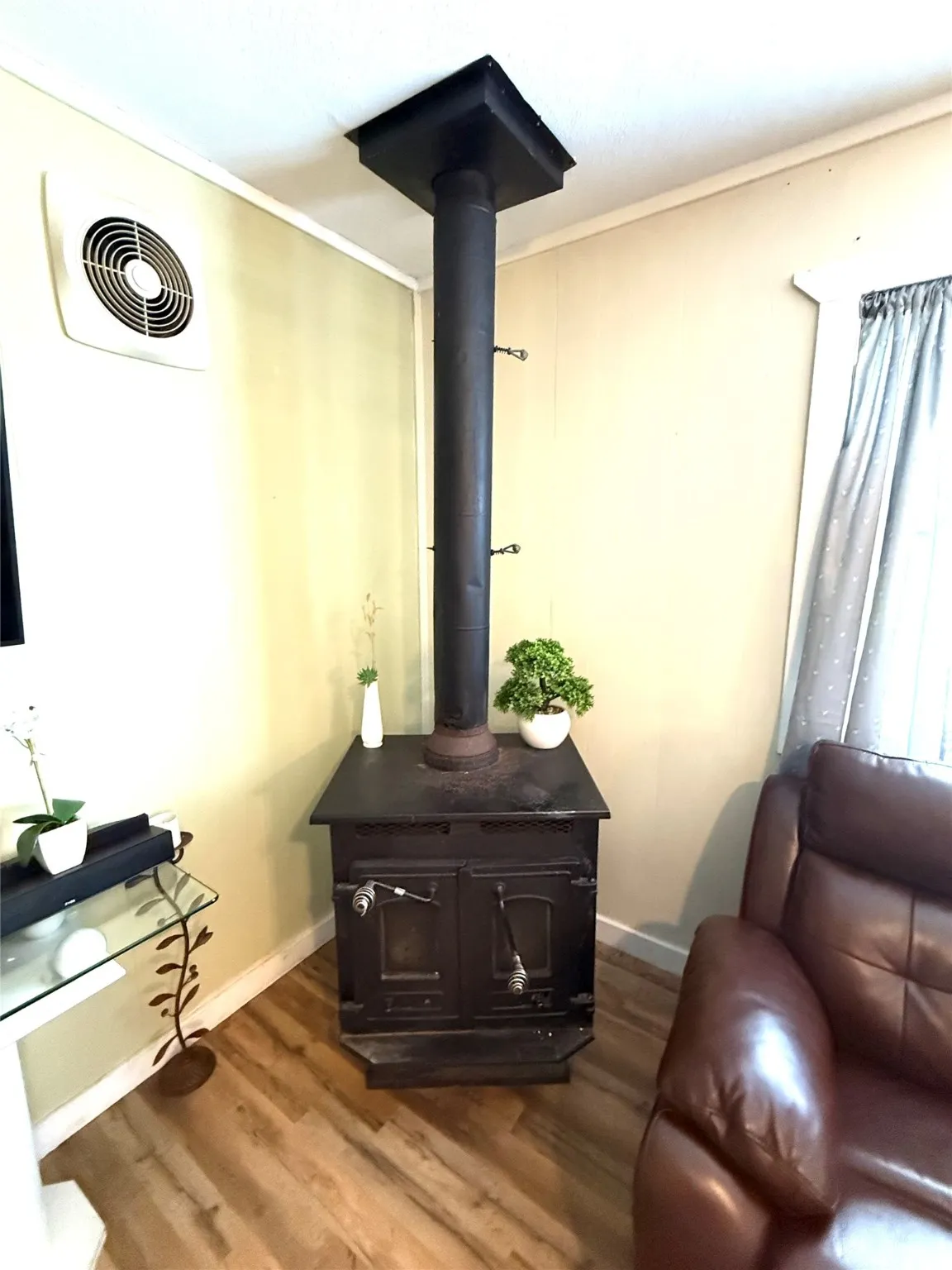 Detailed view of a wood stove and wood finished floors