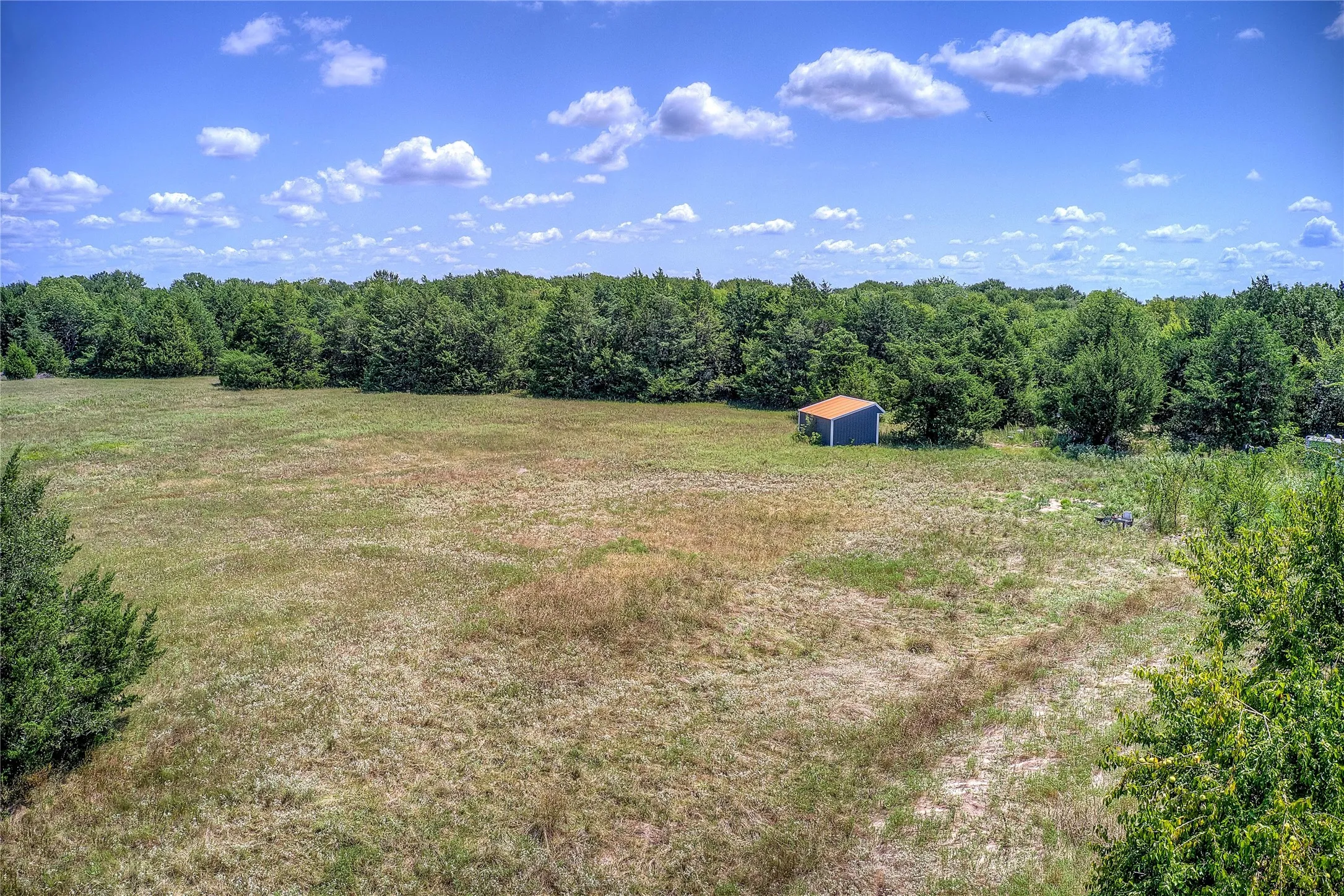View of rural area featuring a heavily wooded area