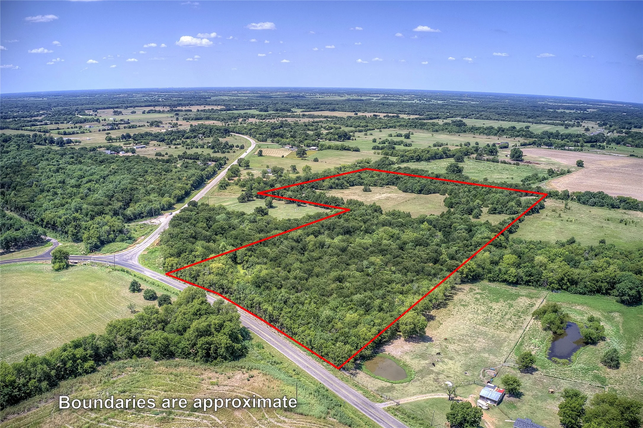 Overview of rural landscape with property parcel outlined