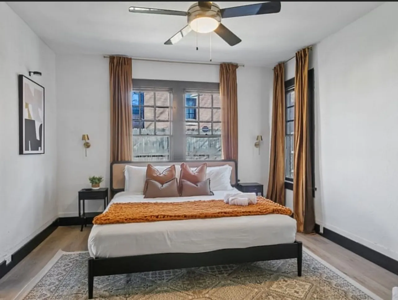 Bedroom featuring wood finished floors and ceiling fan