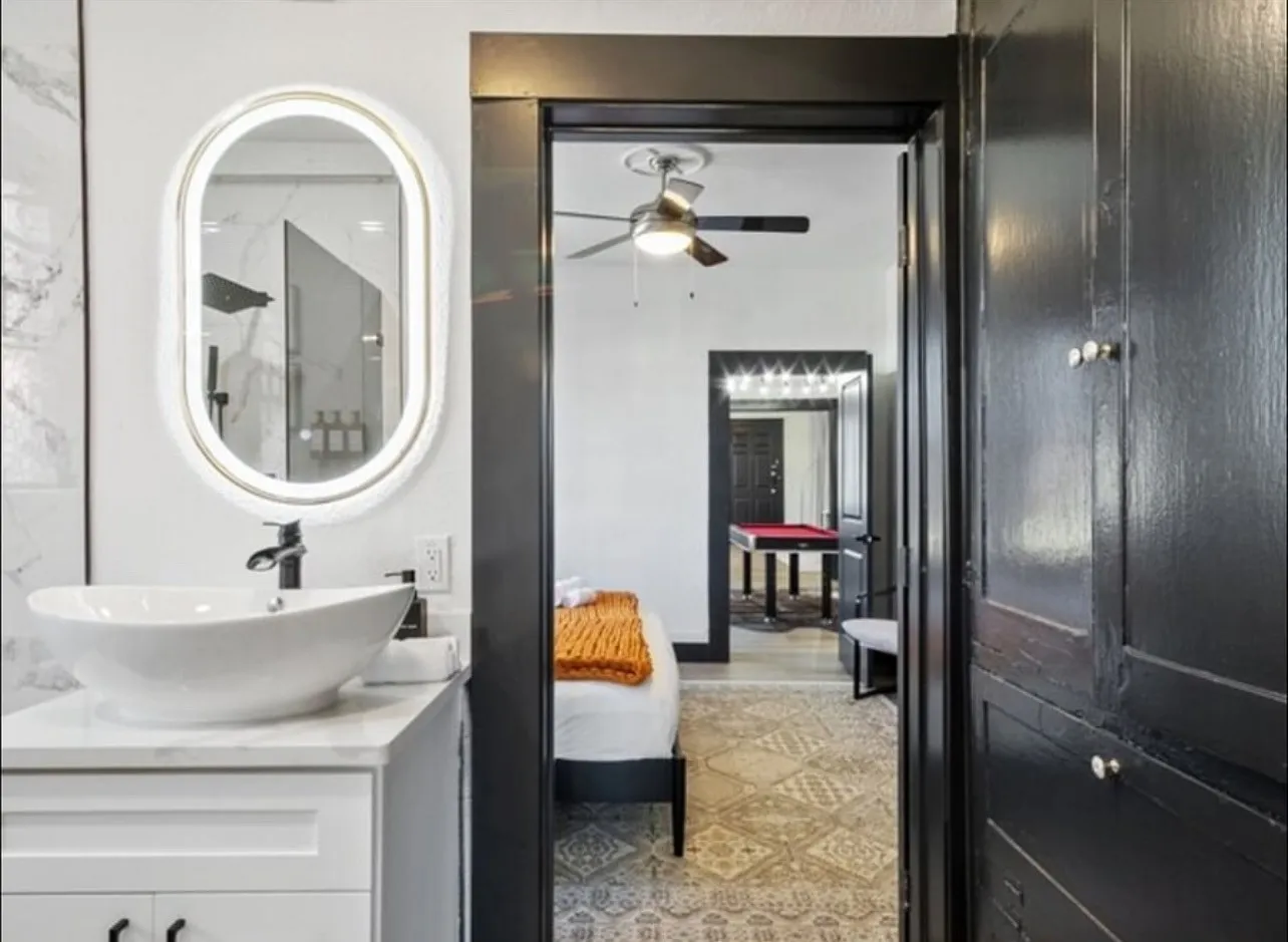 Full bathroom with vanity, ensuite bath, and a ceiling fan