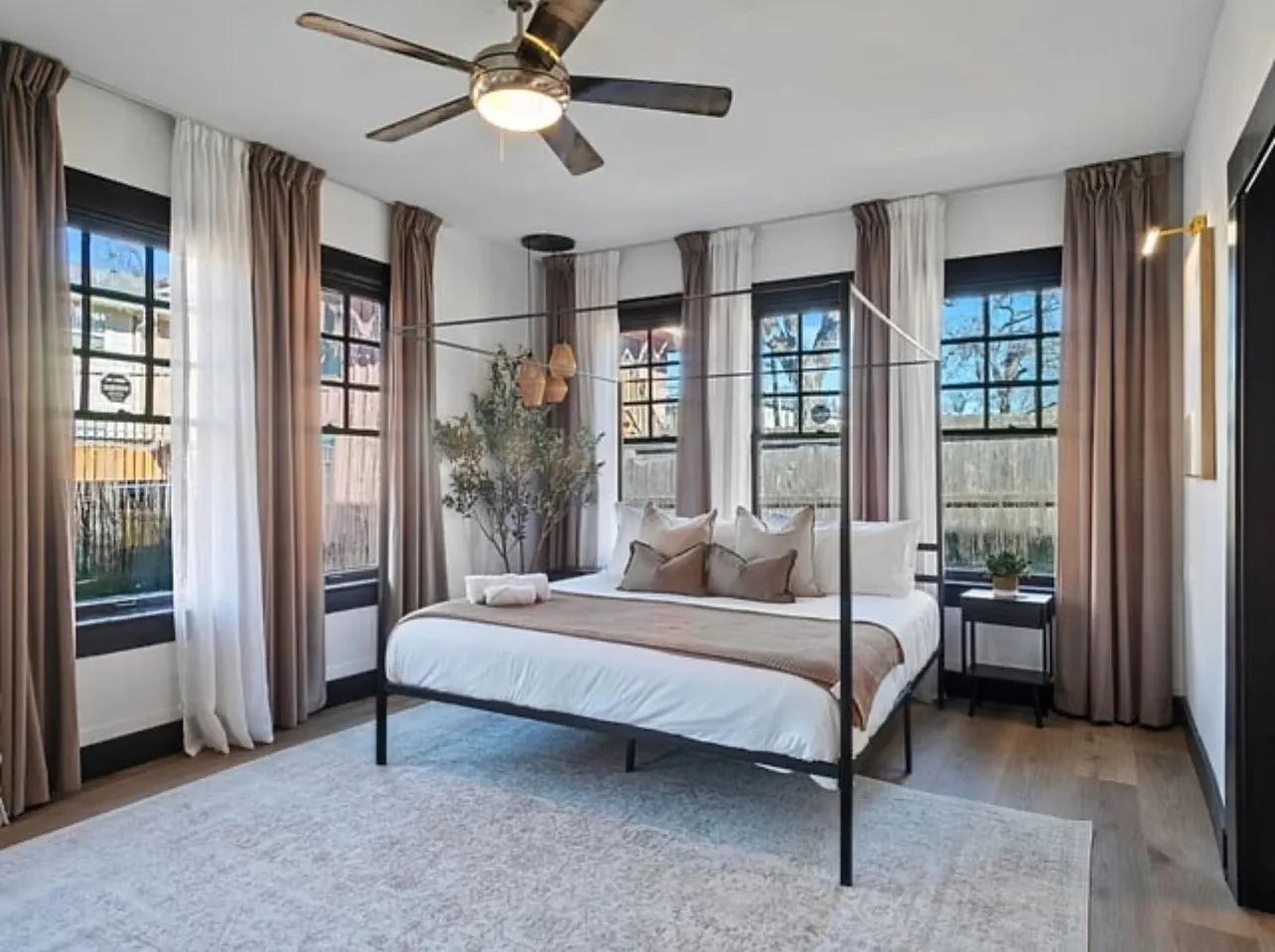 Bedroom with wood finished floors and ceiling fan