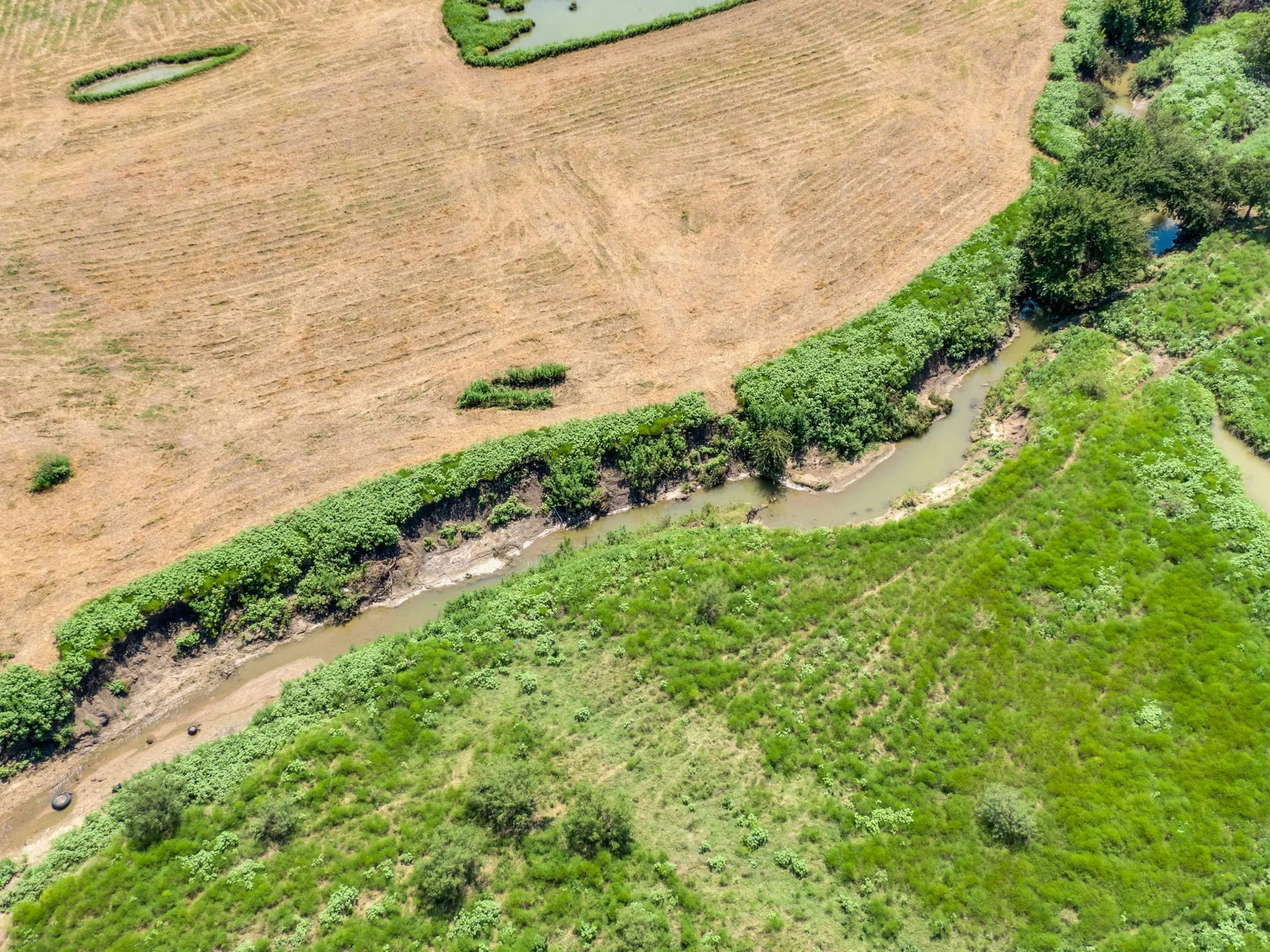 Aerial view of the stream at the rear of the property.