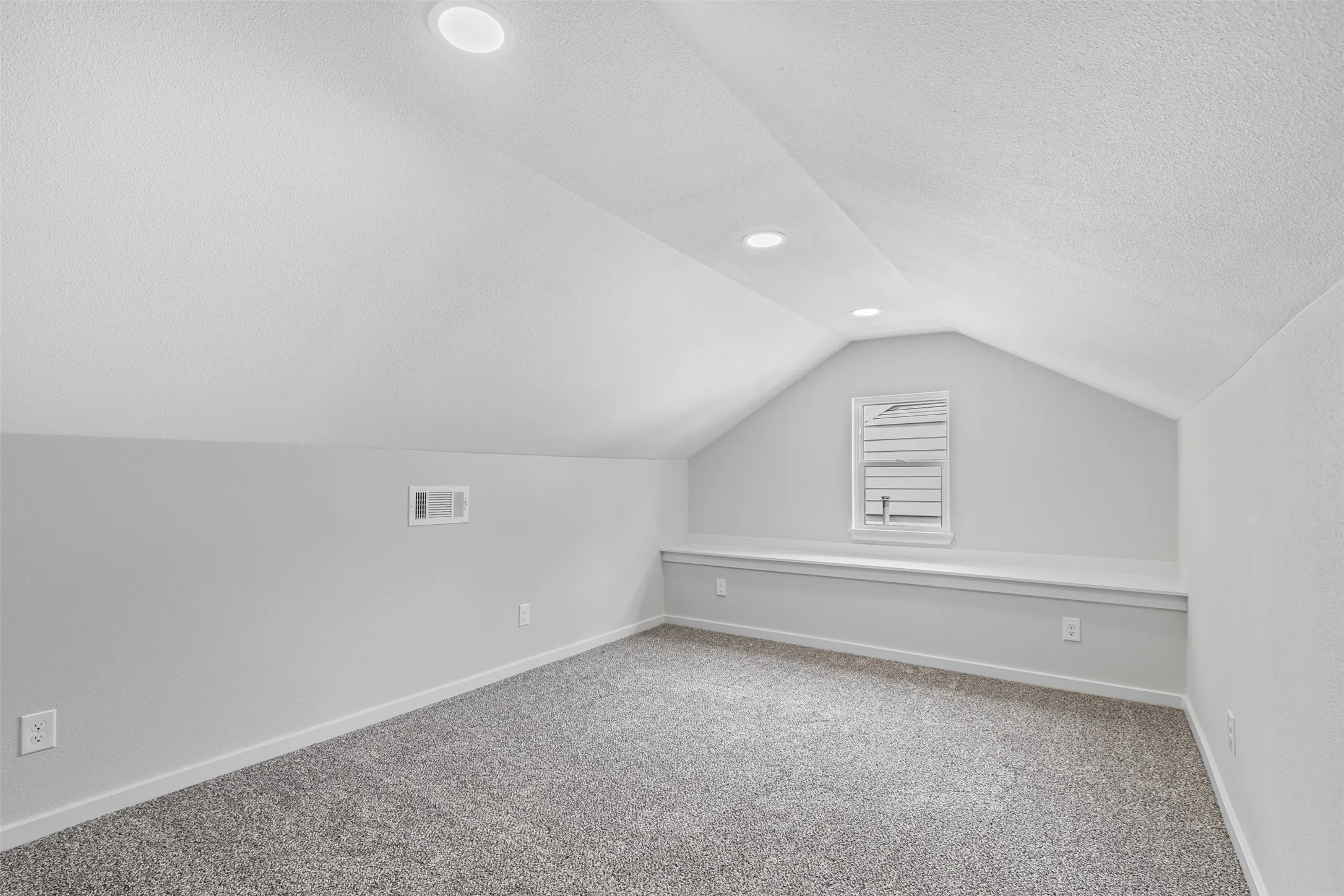 Additional living space with carpet flooring, lofted ceiling, recessed lighting, and a textured ceiling