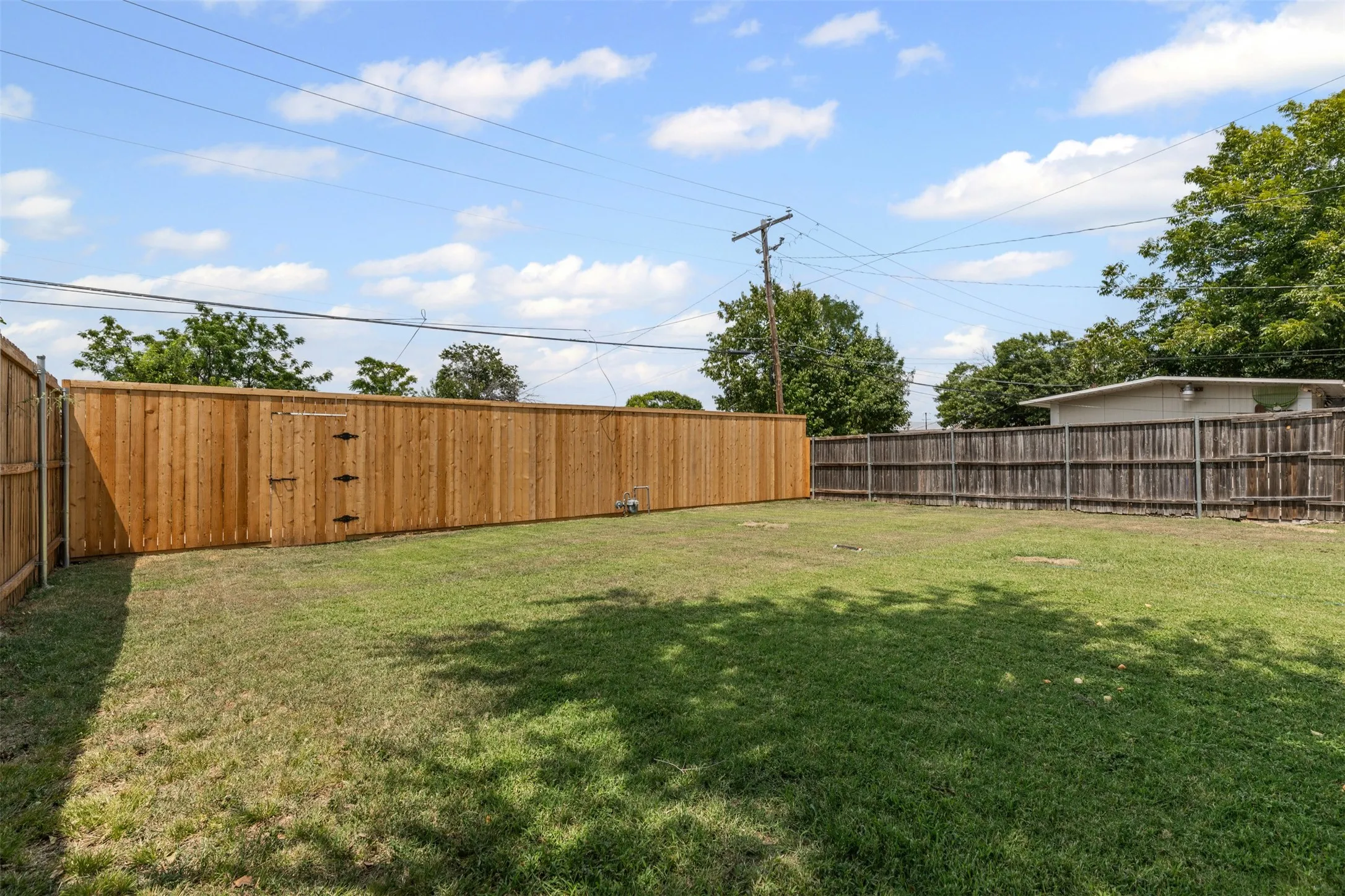 View of fenced backyard