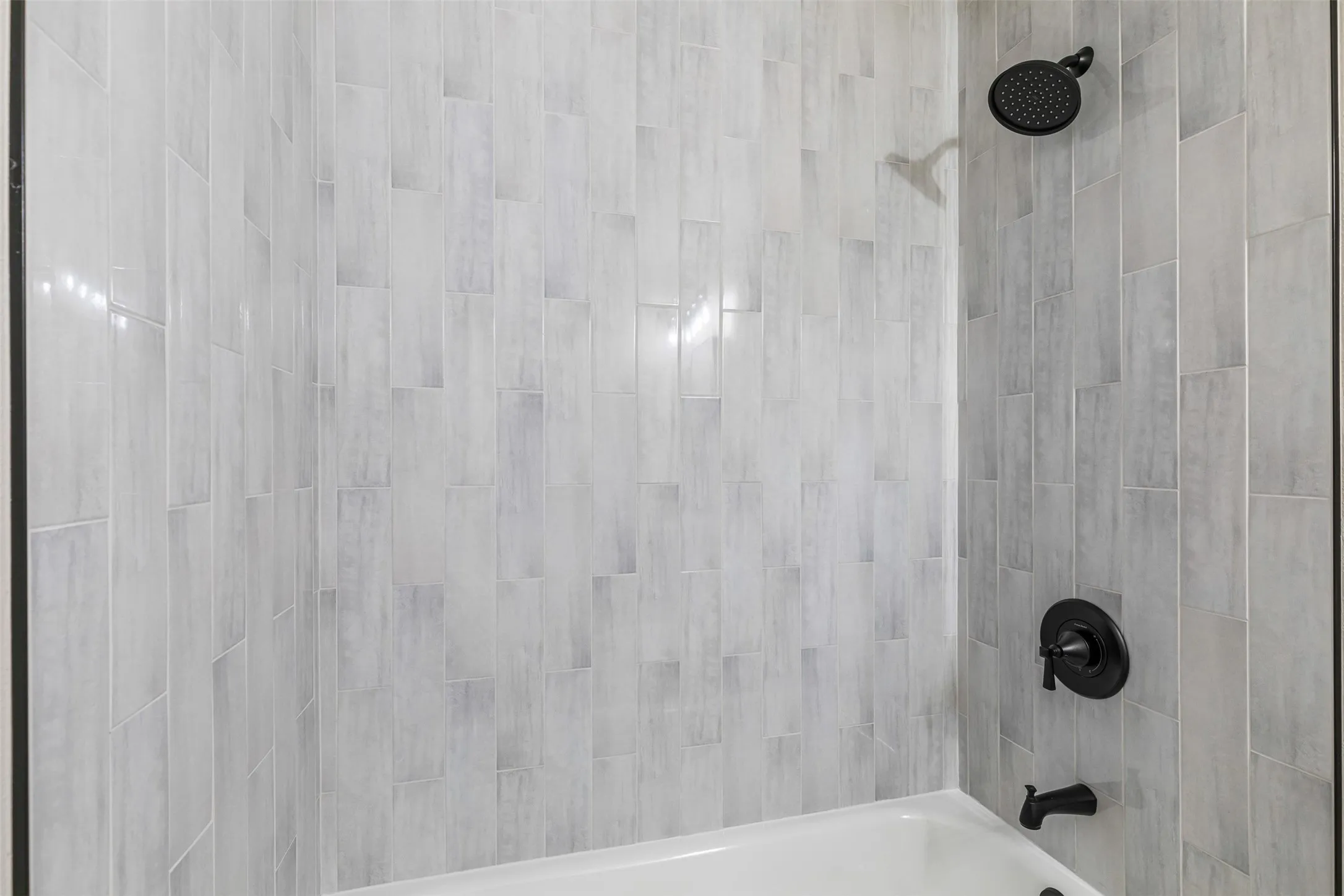 Bathroom view of washtub / shower combination