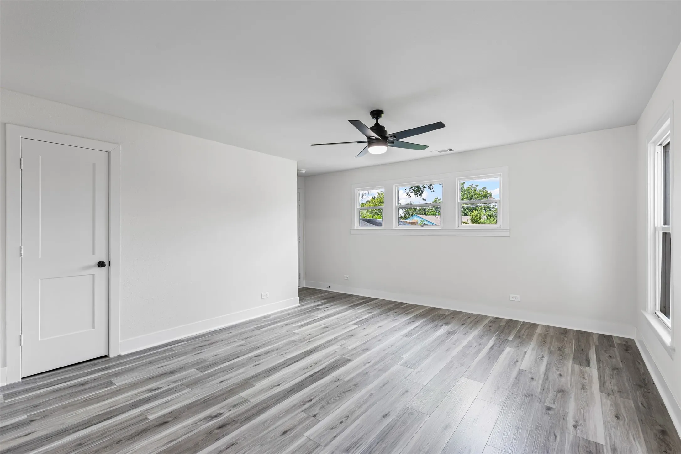 Unfurnished bedroom featuring light wood finished floors and a ceiling fan