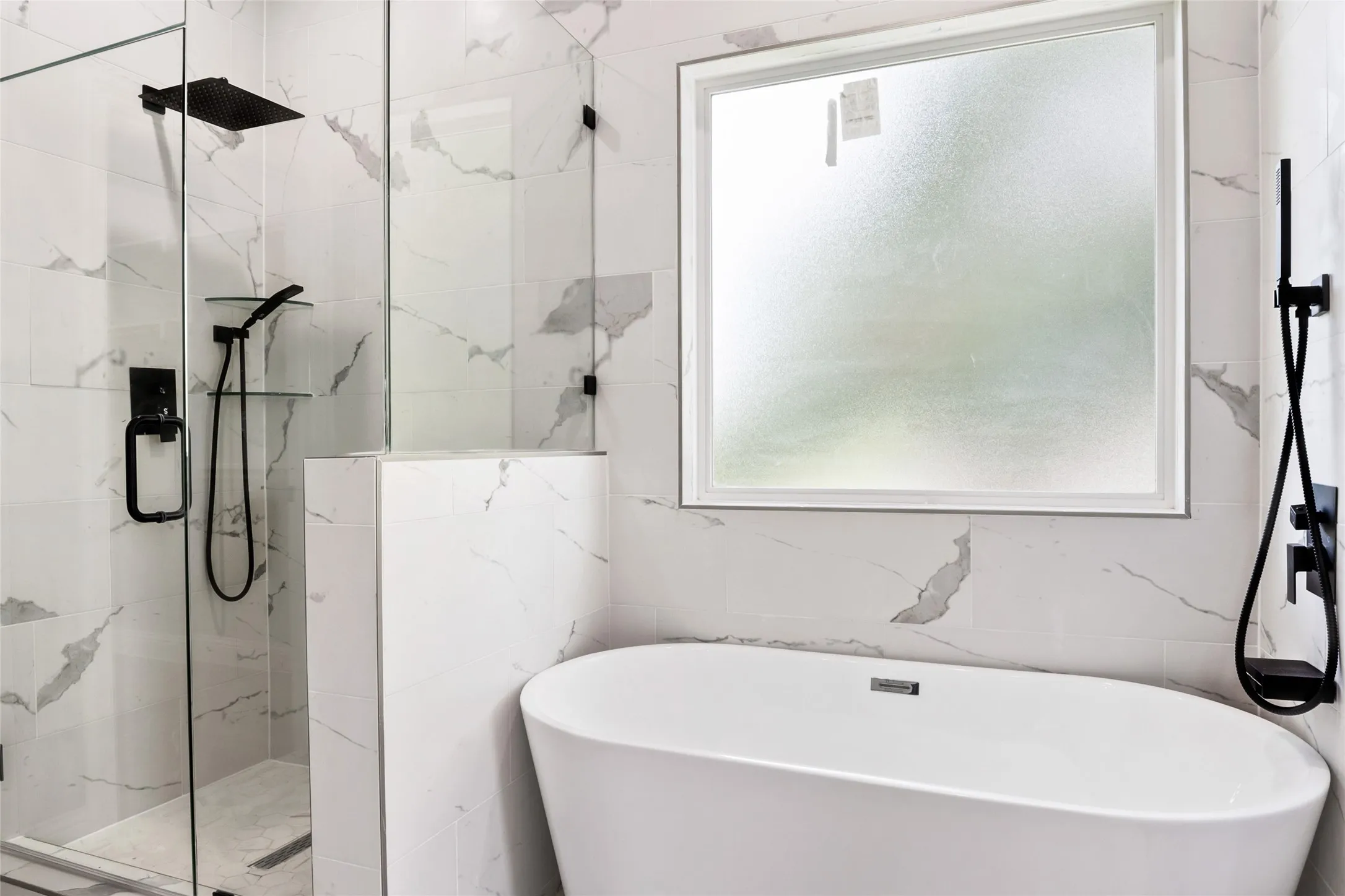 Master Bathroom with a chic modern finish shower, custom hardware, fixtures and a soaking tub