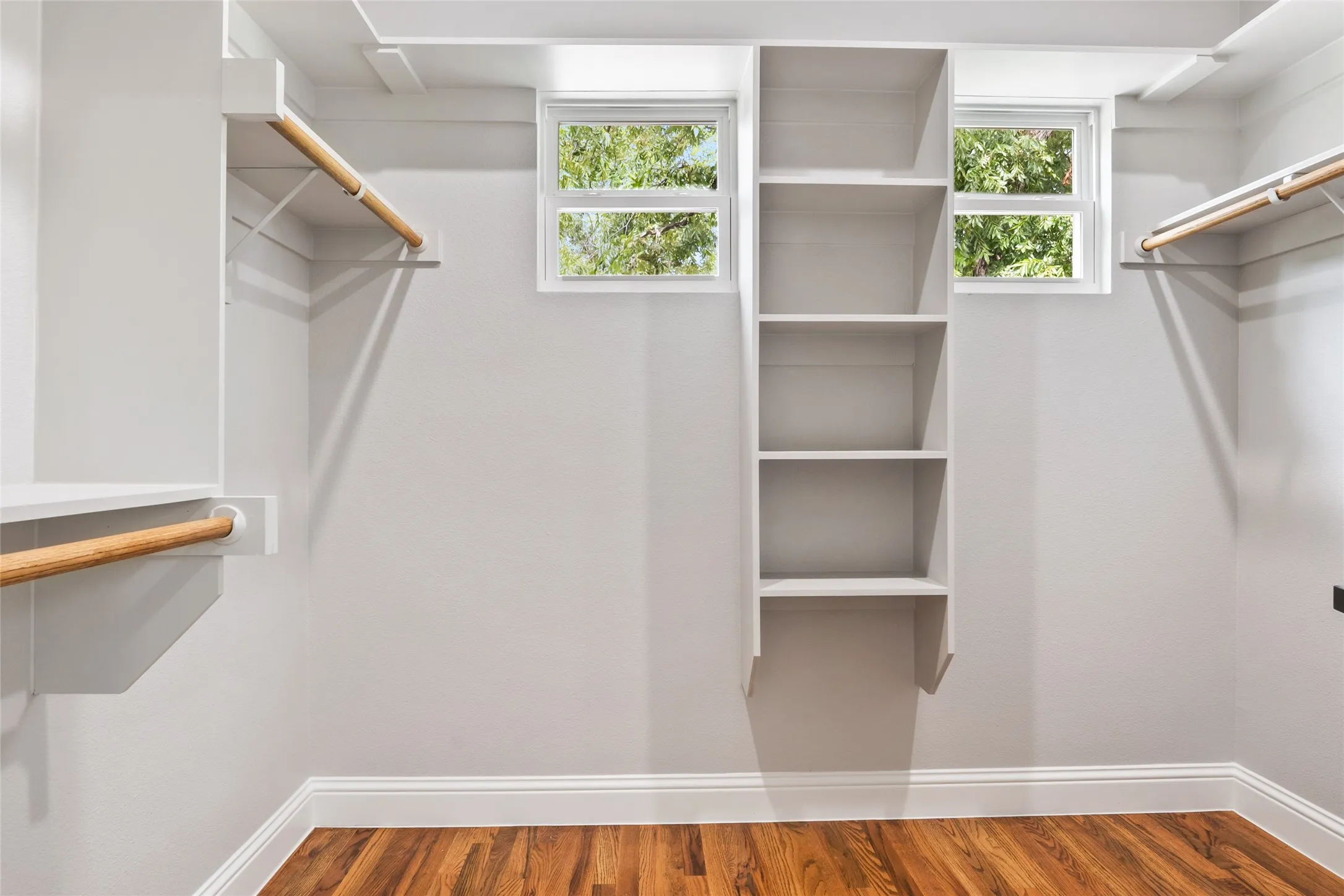 Spacious closet with wood finished floors