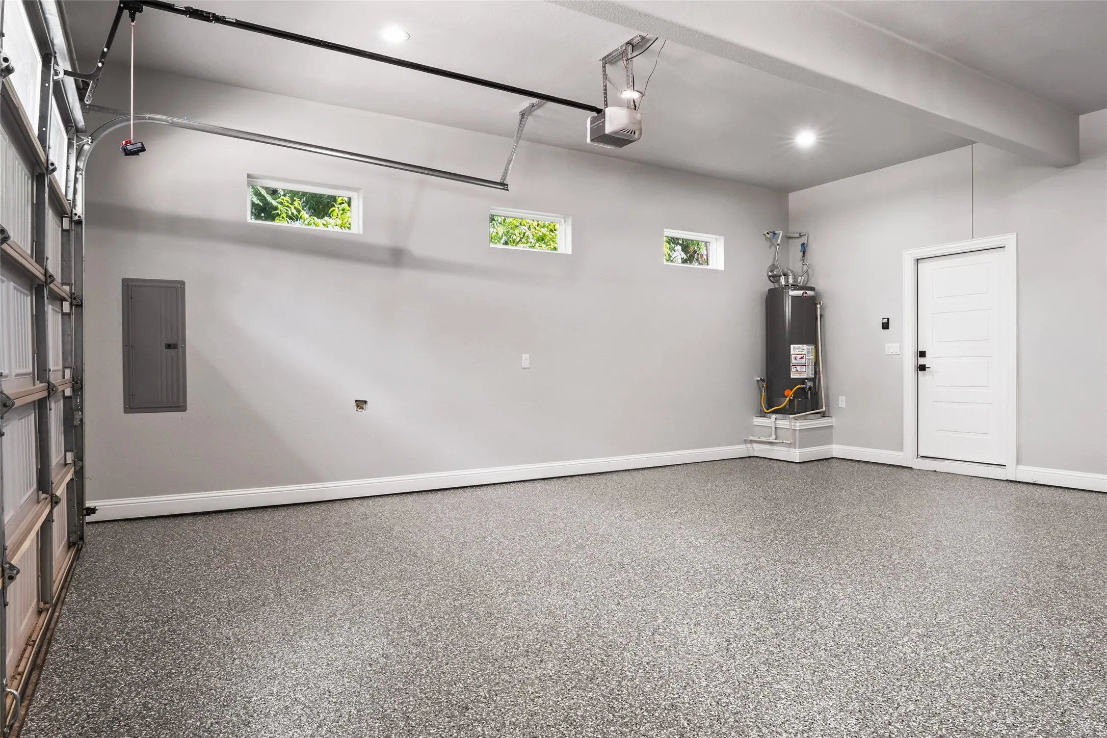 2 Car Garage with Beautiful Custom durable and considerate long term value Epoxy Floor coating  recessed lighting, and 2 garage opener