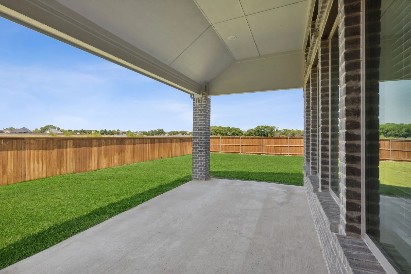 Covered Patio in the Henley home plan by Trophy Signature Homes – REPRESENTATIVE PHOTO