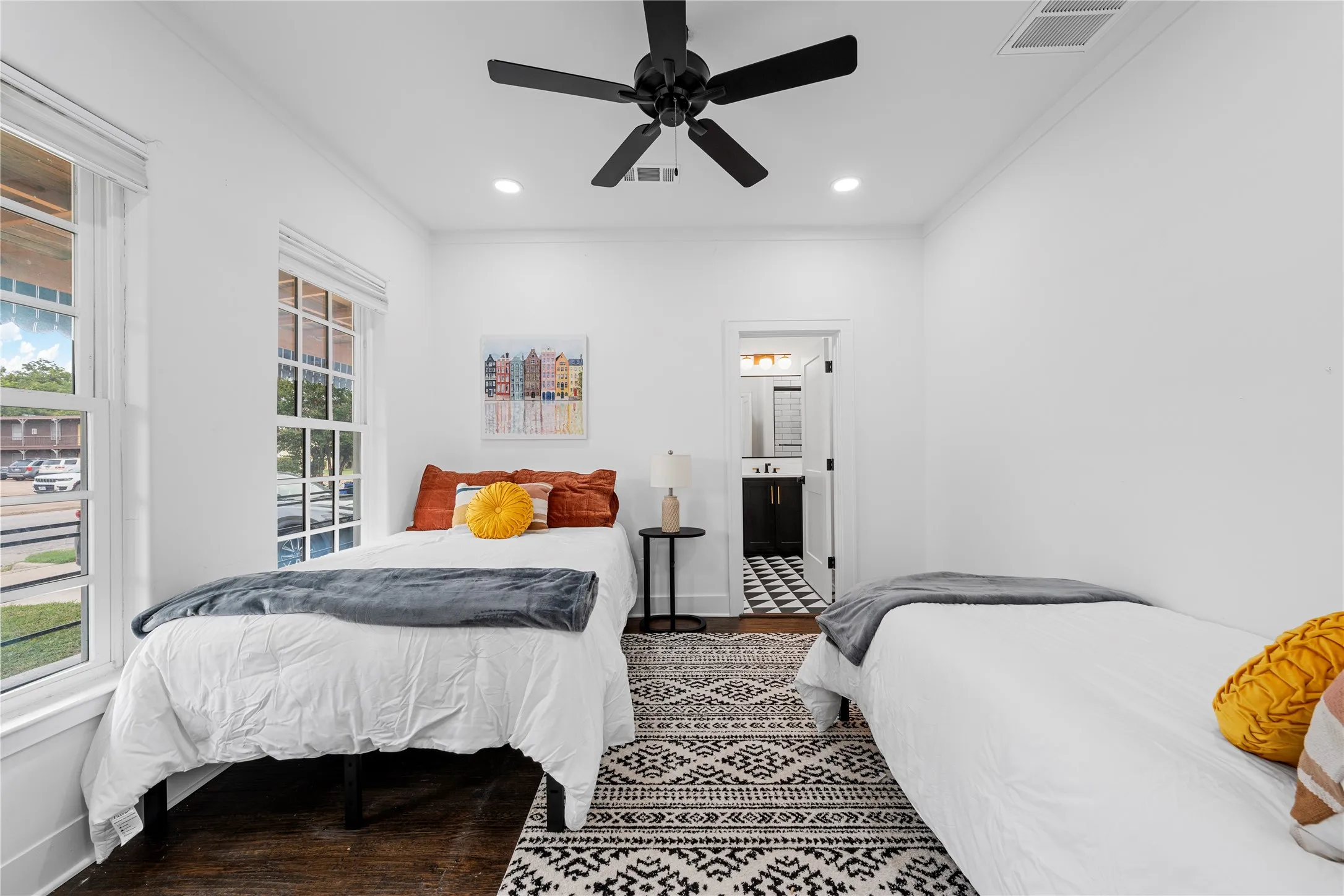 Bedroom featuring ornamental molding, wood finished floors, a ceiling fan, ensuite bath, and recessed lighting