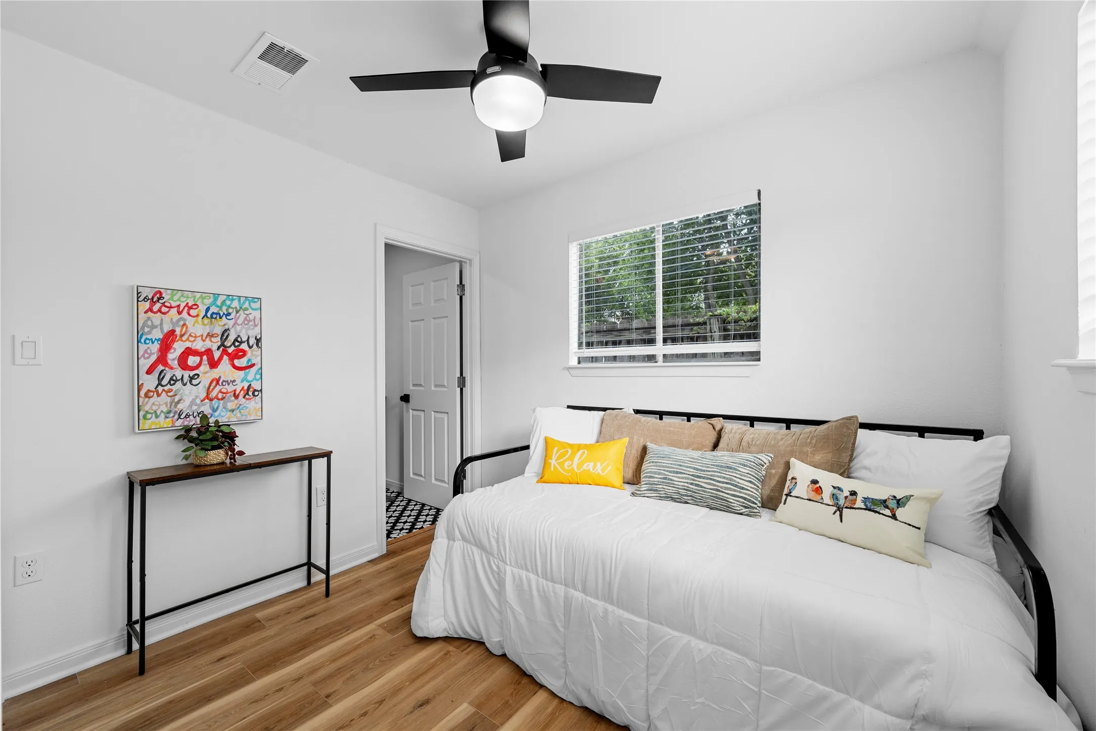 Bedroom featuring light wood-style floors and ceiling fan