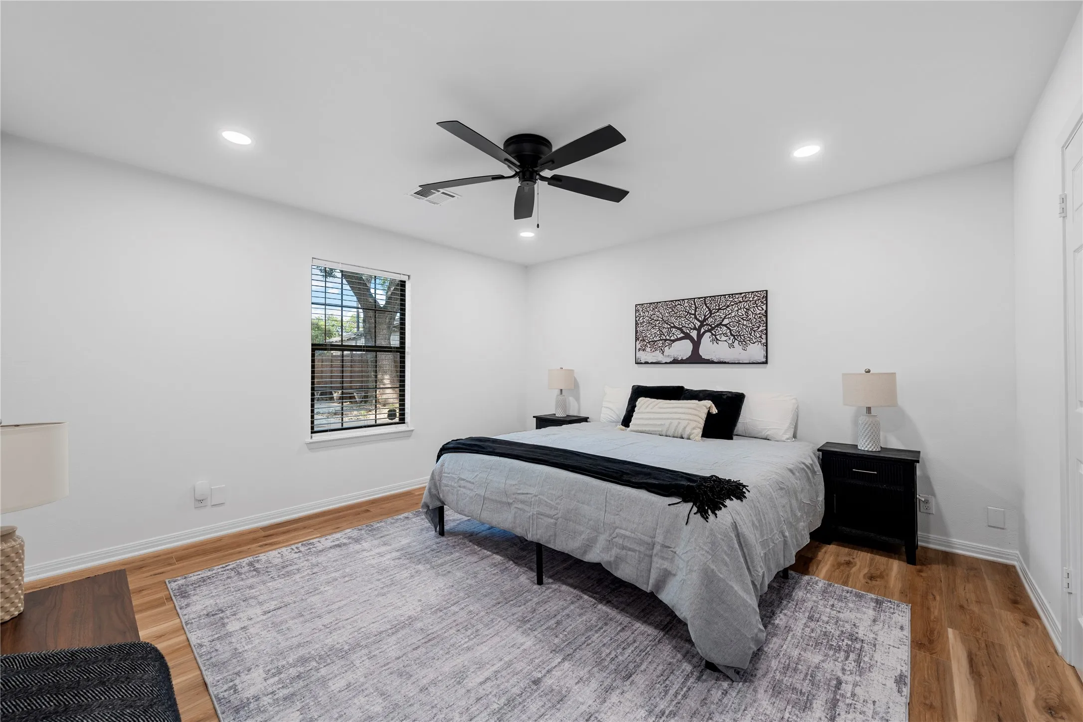 Bedroom featuring recessed lighting, ceiling fan, and light wood-style flooring