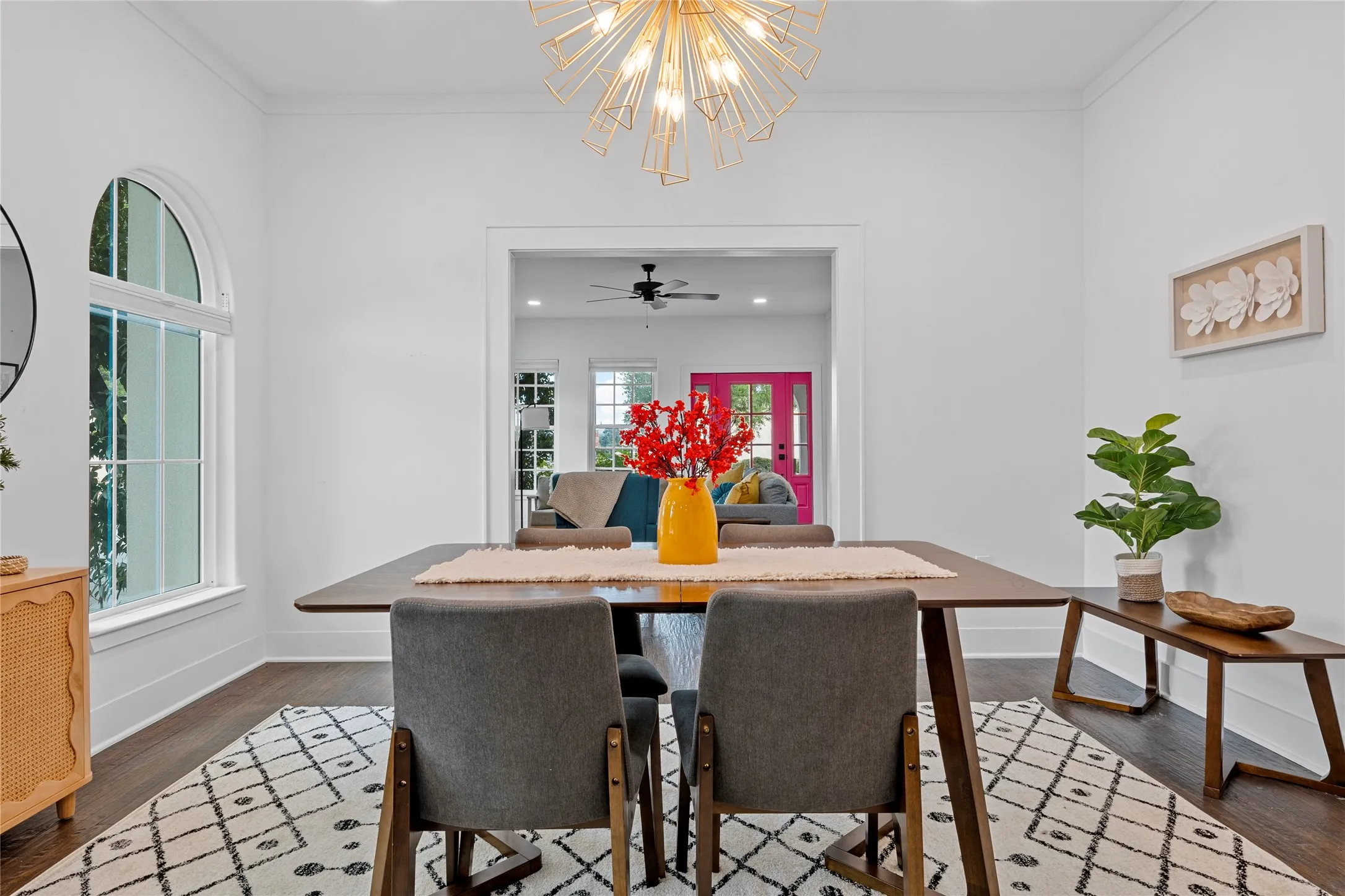Dining room featuring dark wood-type flooring, a chandelier, recessed lighting, and ornamental molding