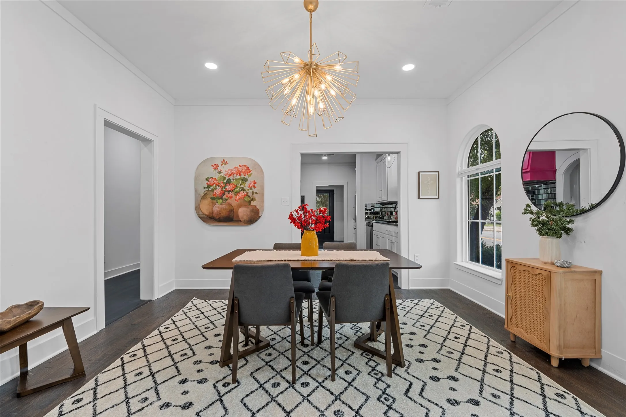 Dining space with crown molding, recessed lighting, dark wood-style floors, and a chandelier