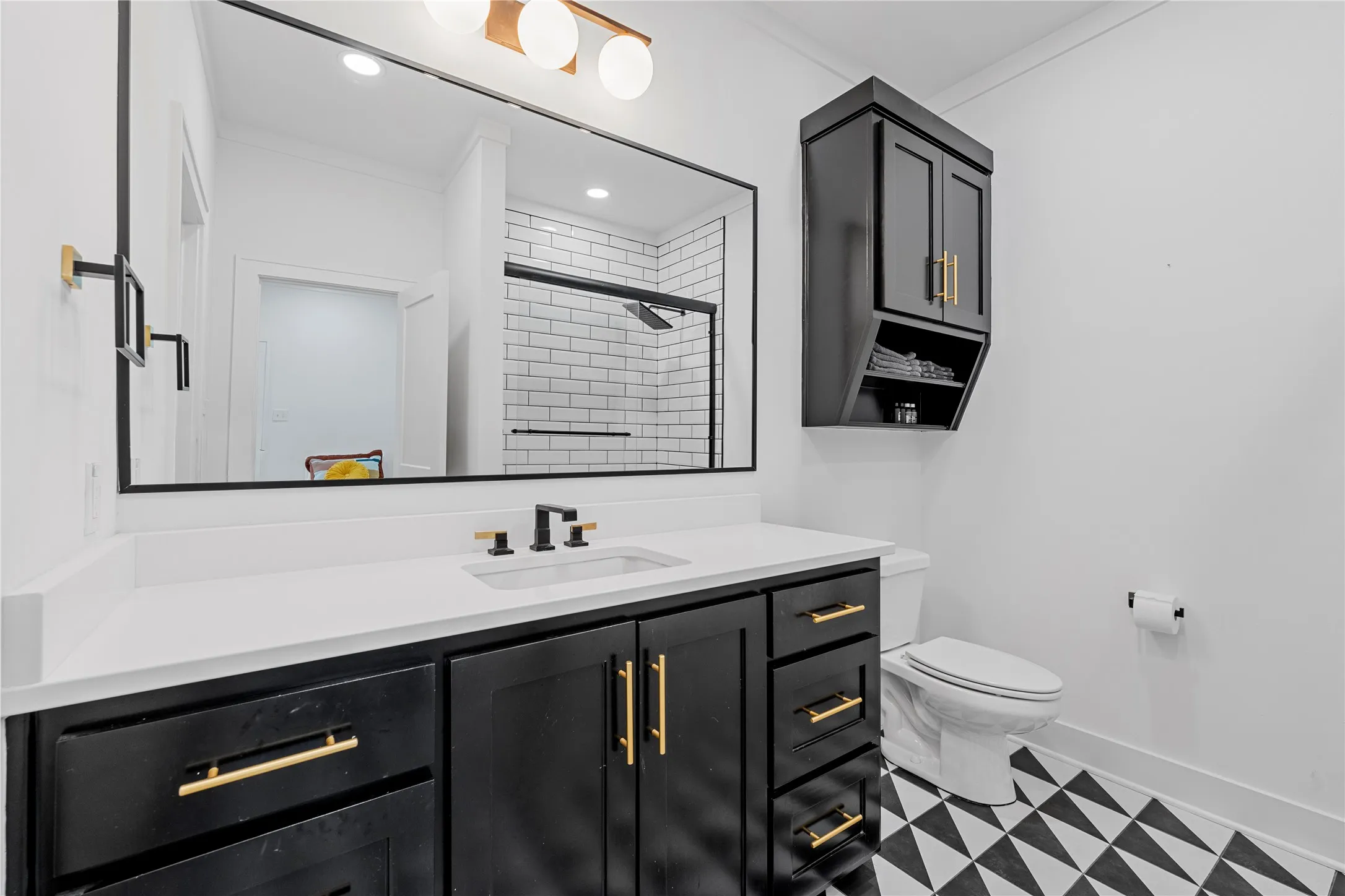 Bathroom featuring vanity, a shower stall, and recessed lighting