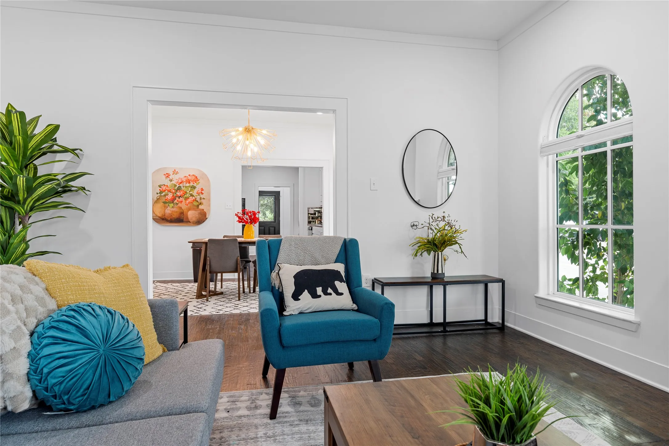 Sitting room featuring wood finished floors and a chandelier