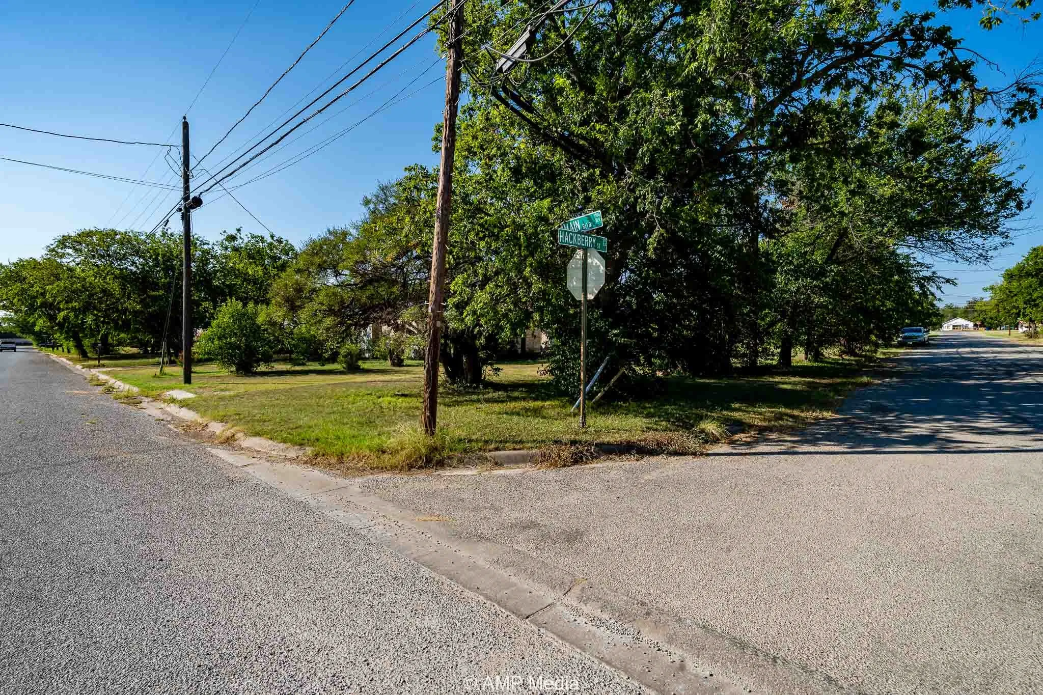 View of asphalt street with curbs