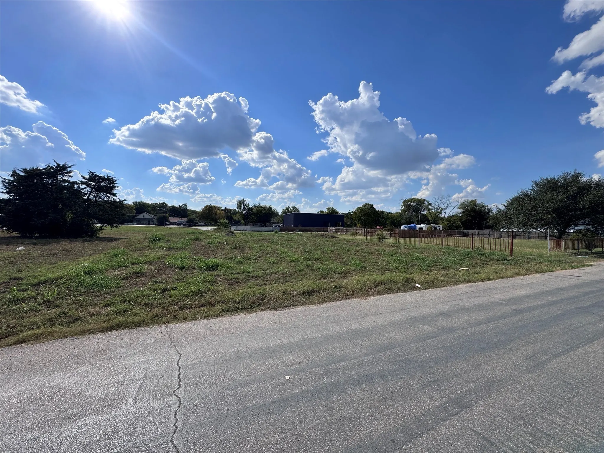 View of asphalt road featuring a view of countryside