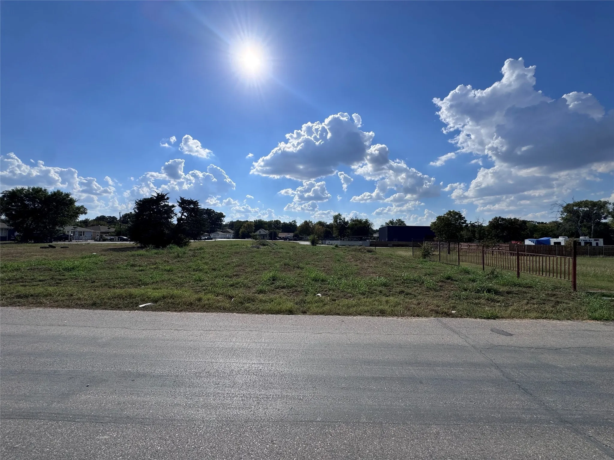 View of asphalt street with a view of rural / pastoral area