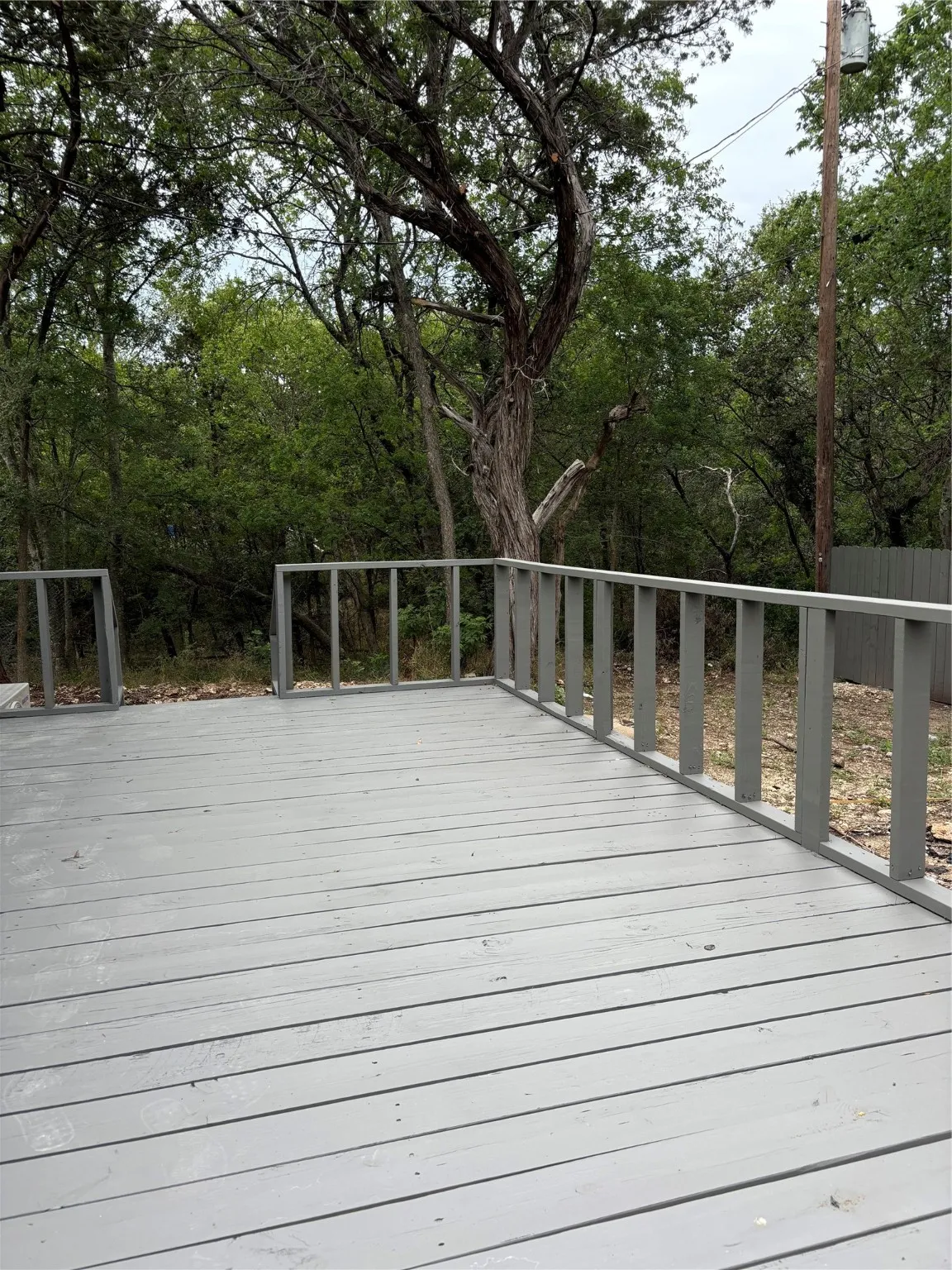 note the wooded space next to this property