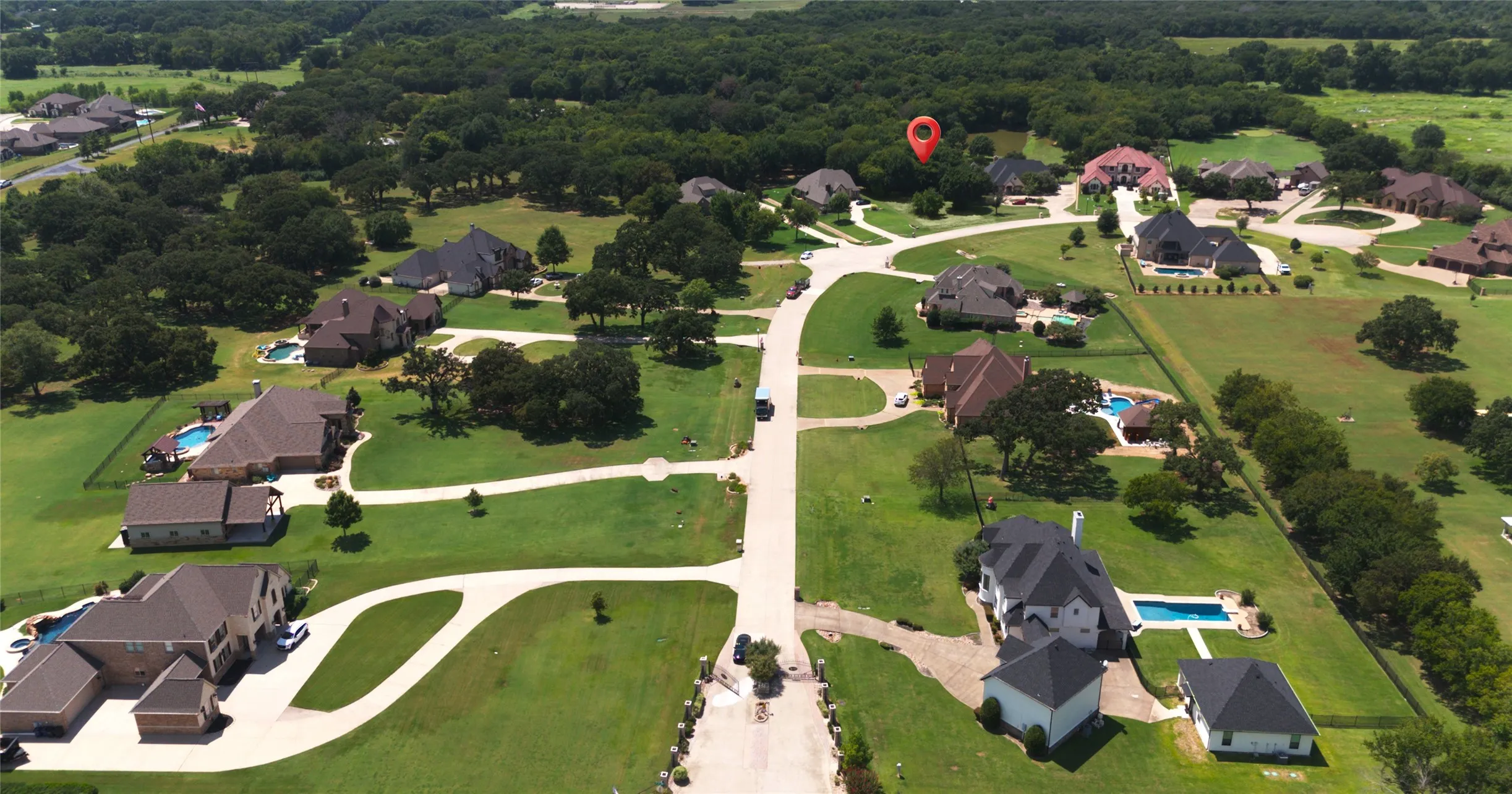 Aerial view of property's location with nearby suburban area