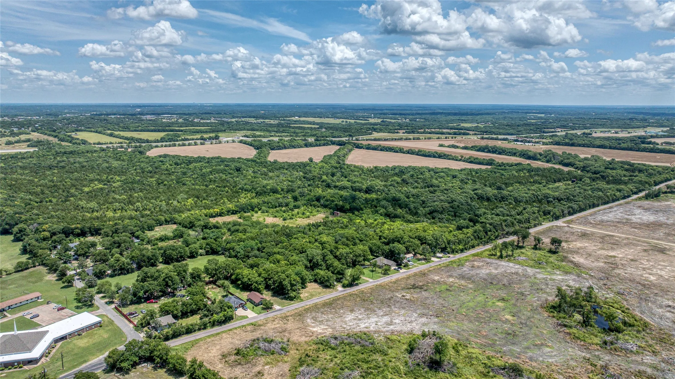 Aerial view of sparsely populated area with abundant farmland