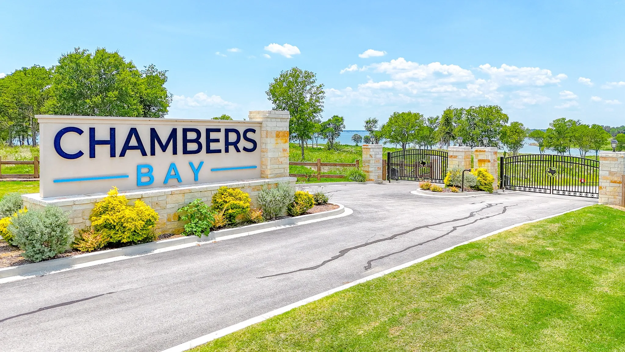 Community sign featuring a gate
