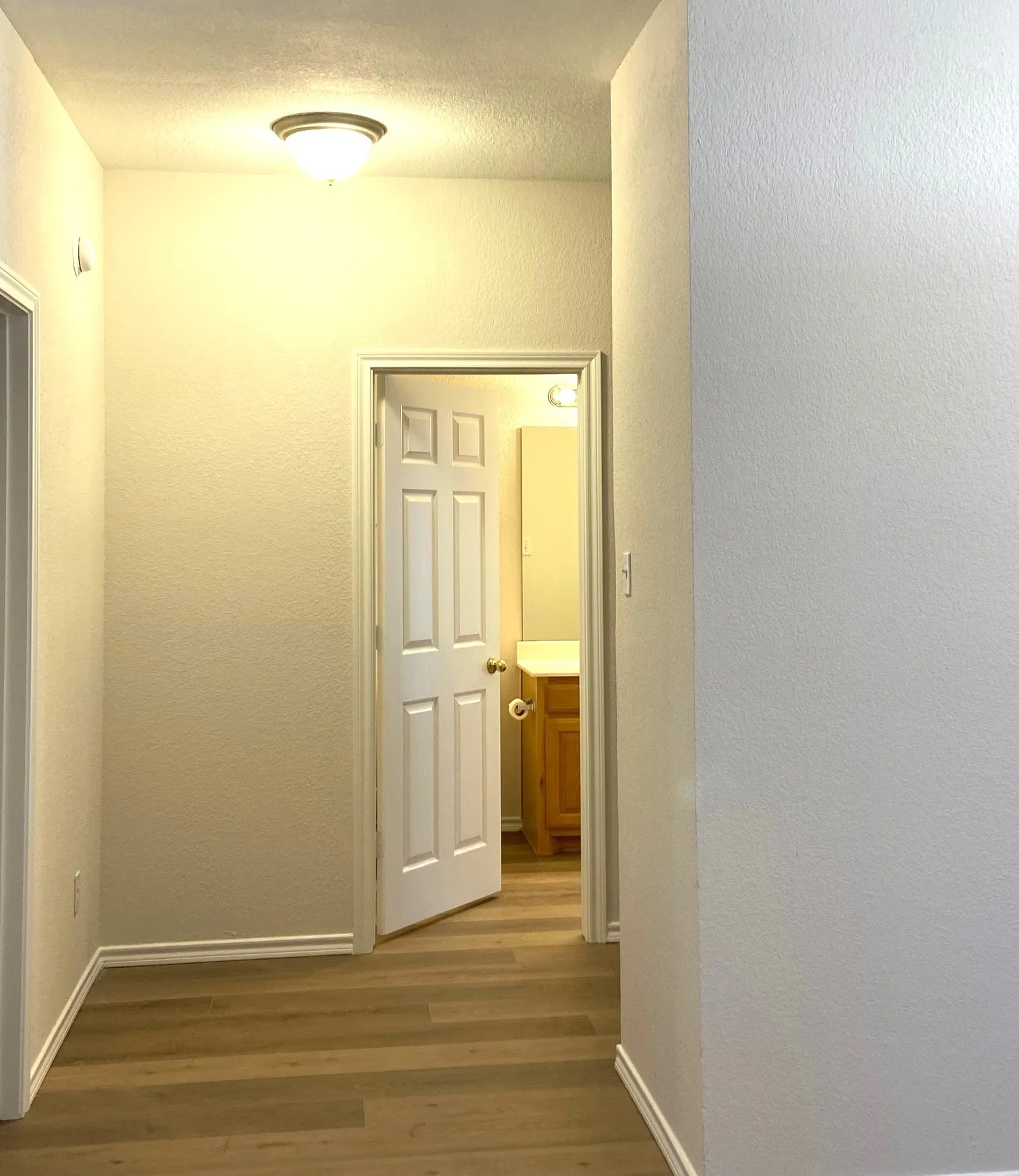 Hallway to master bedroom and guest bath.