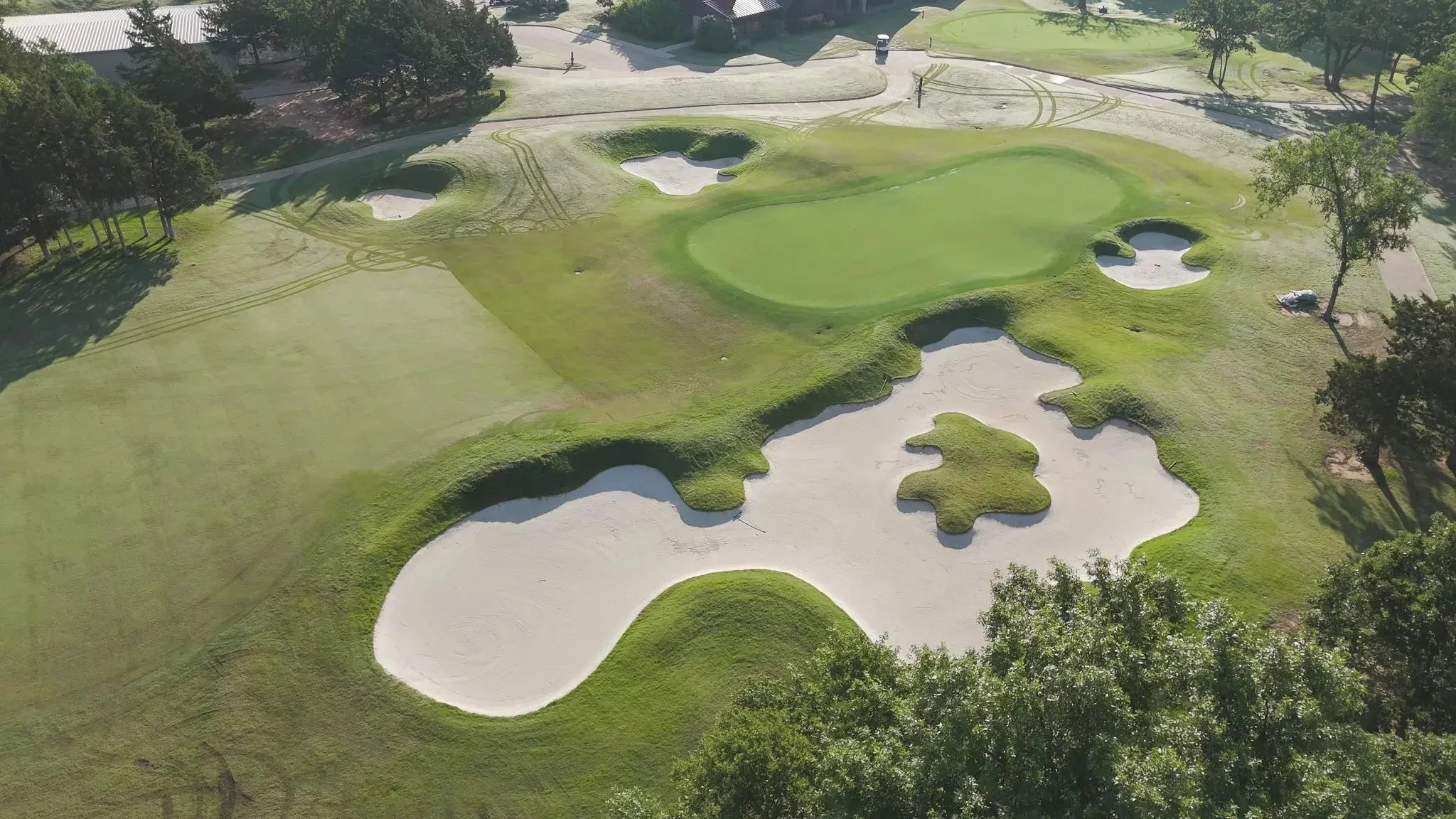 Aerial overview of property's location featuring a local golf course