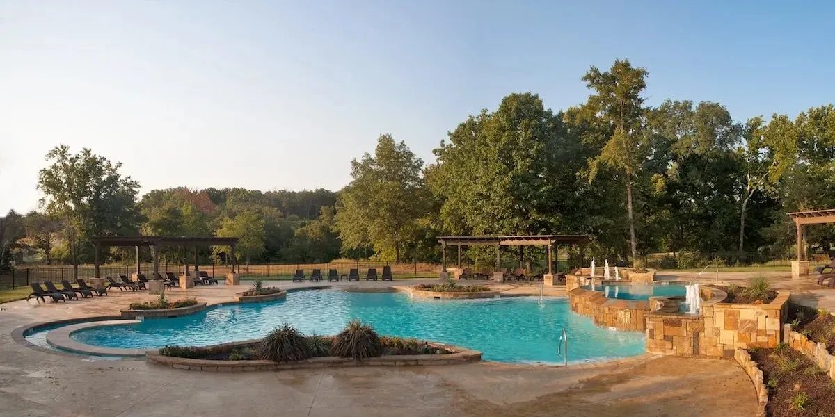 Community pool with a patio and a pergola