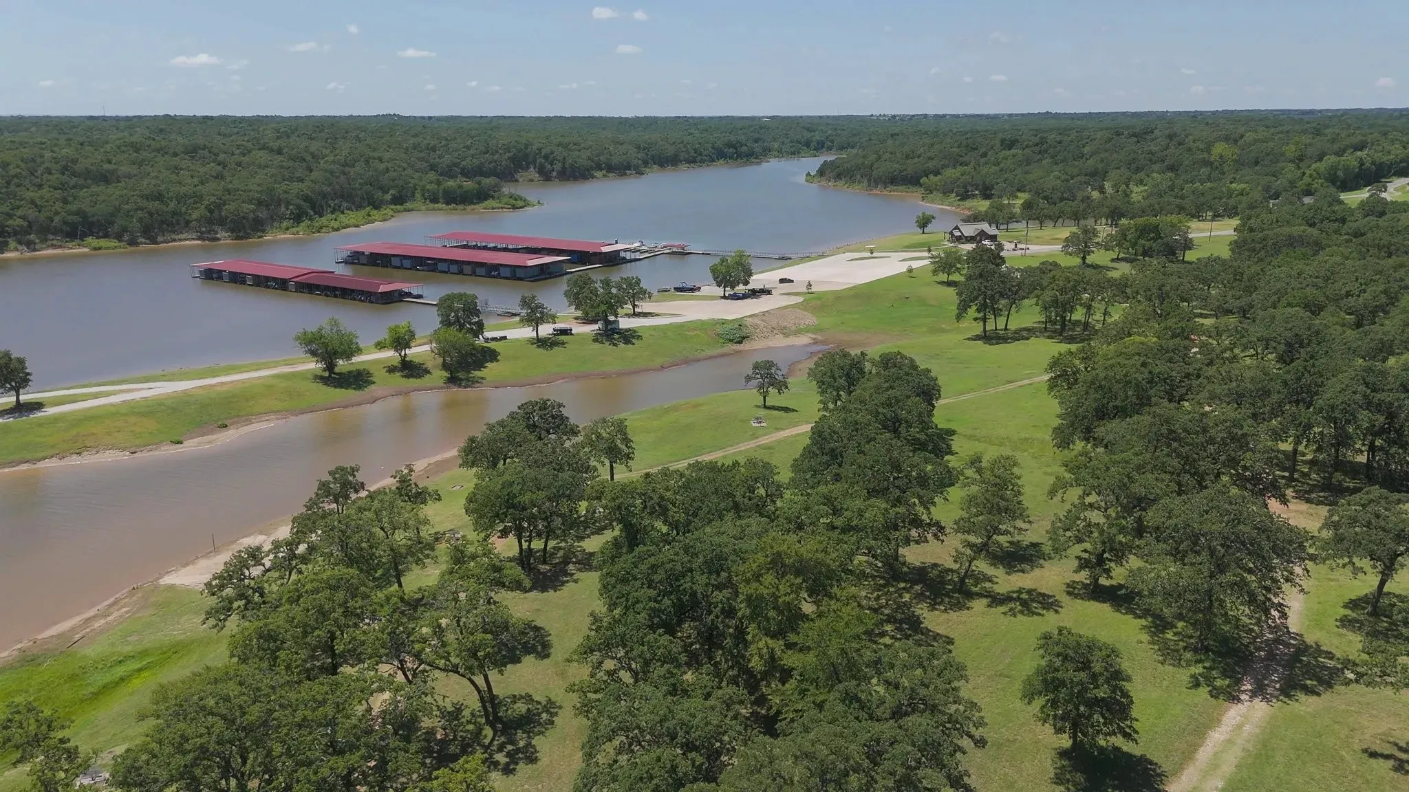 View of property location with a forest and a large body of water