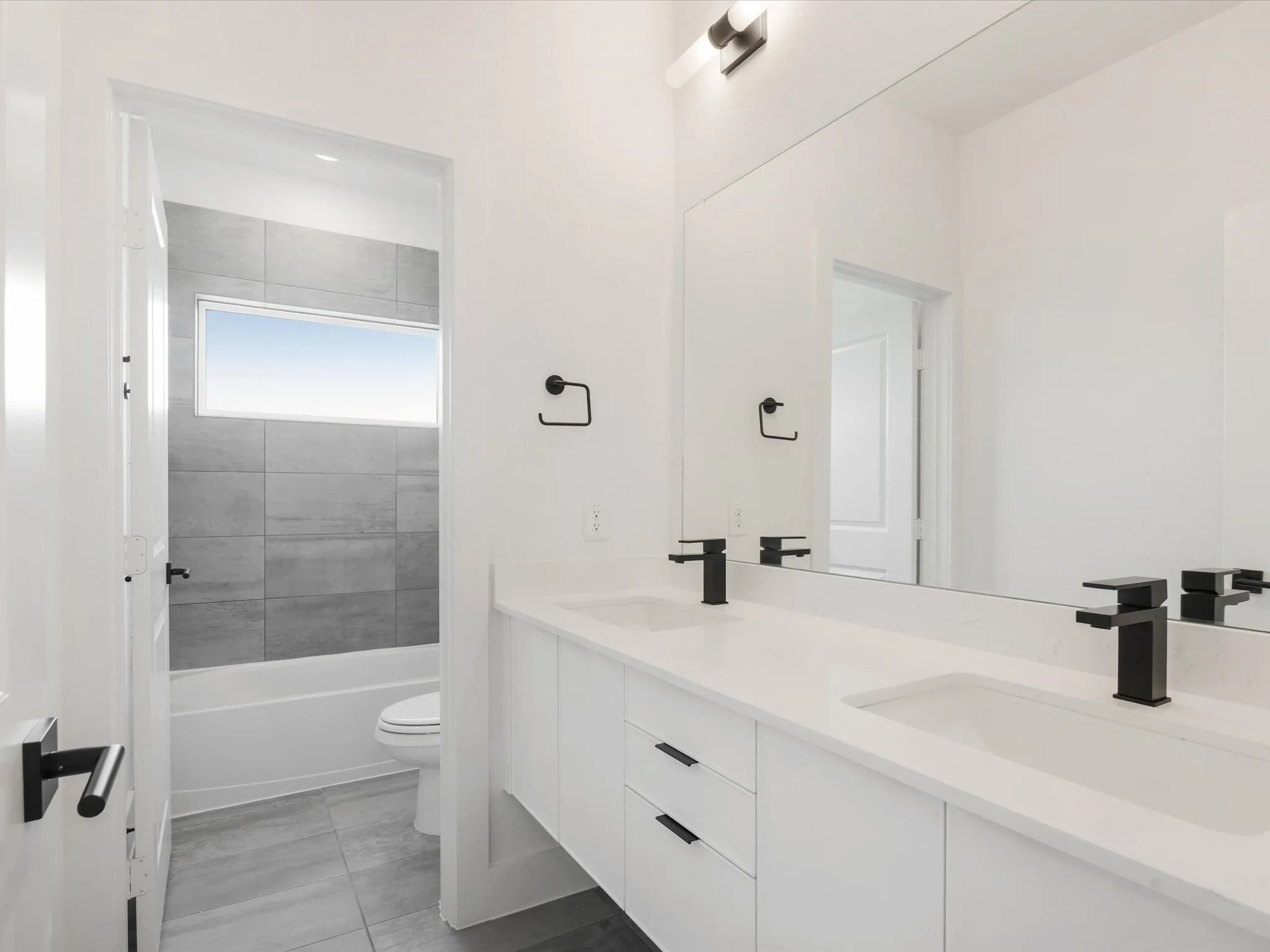 Bathroom 3 featuring shower / washtub combination and light tile patterned floors