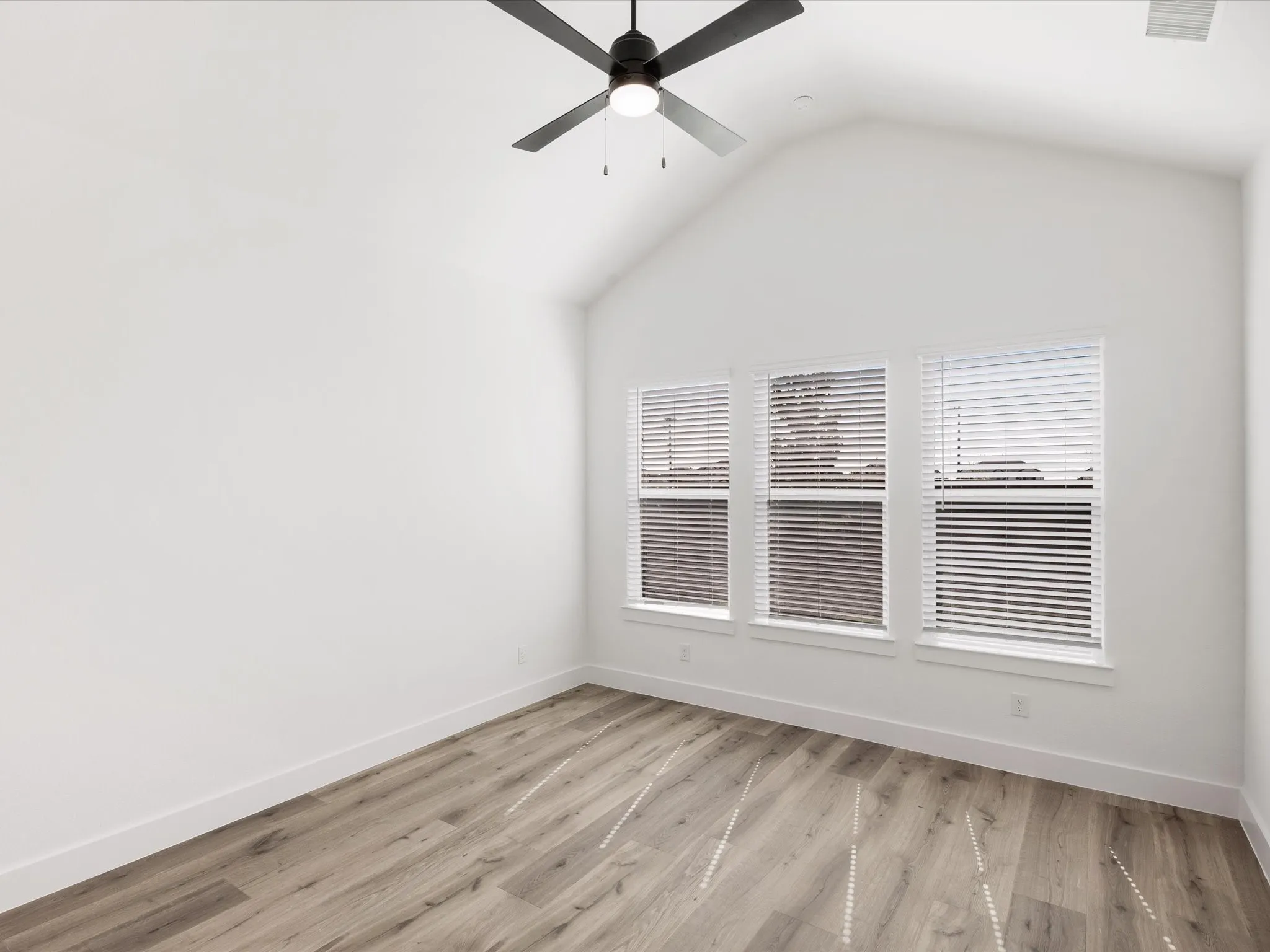 Primary Bedroom down with light wood style floors