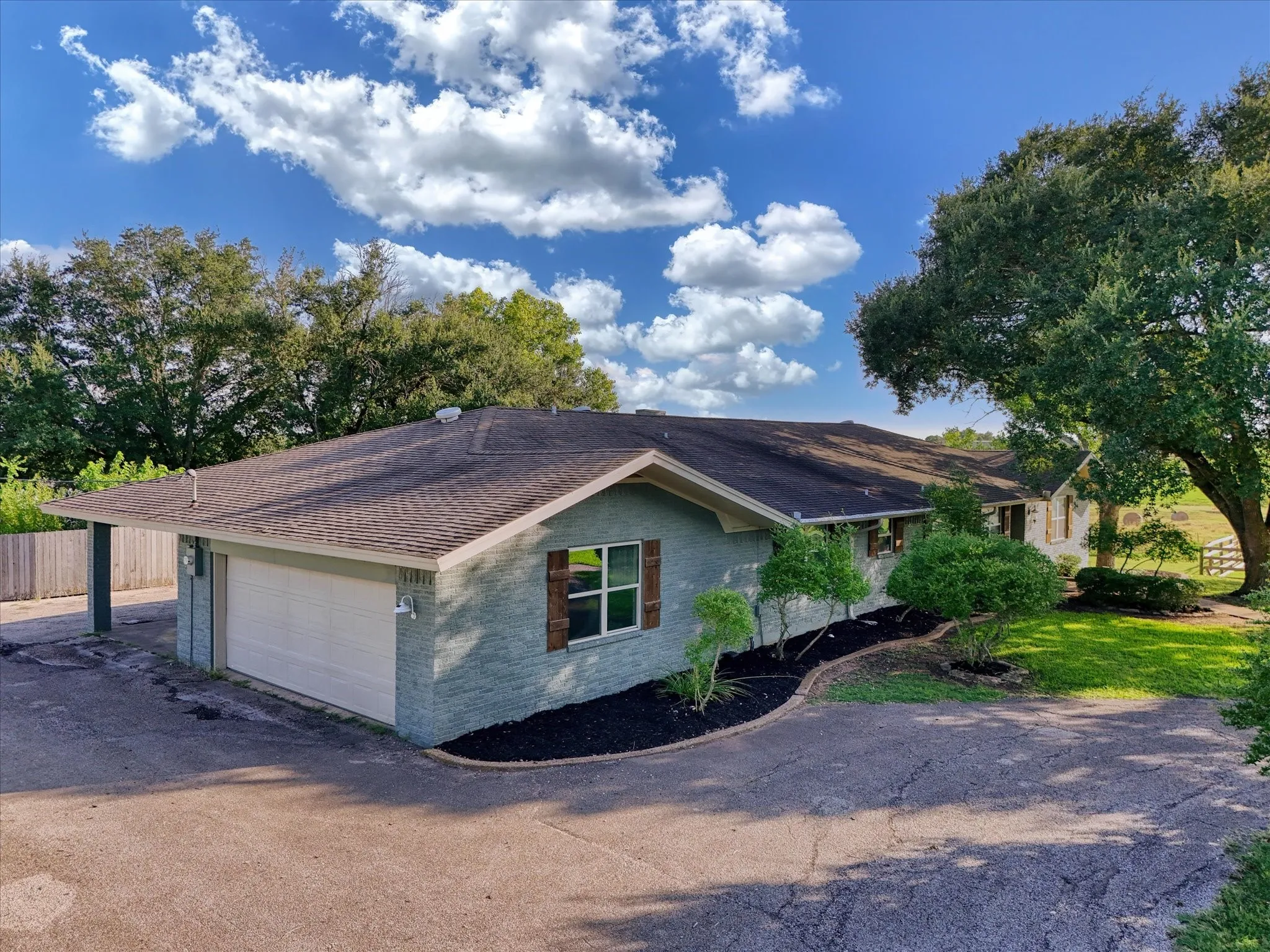 View of property exterior featuring brick siding